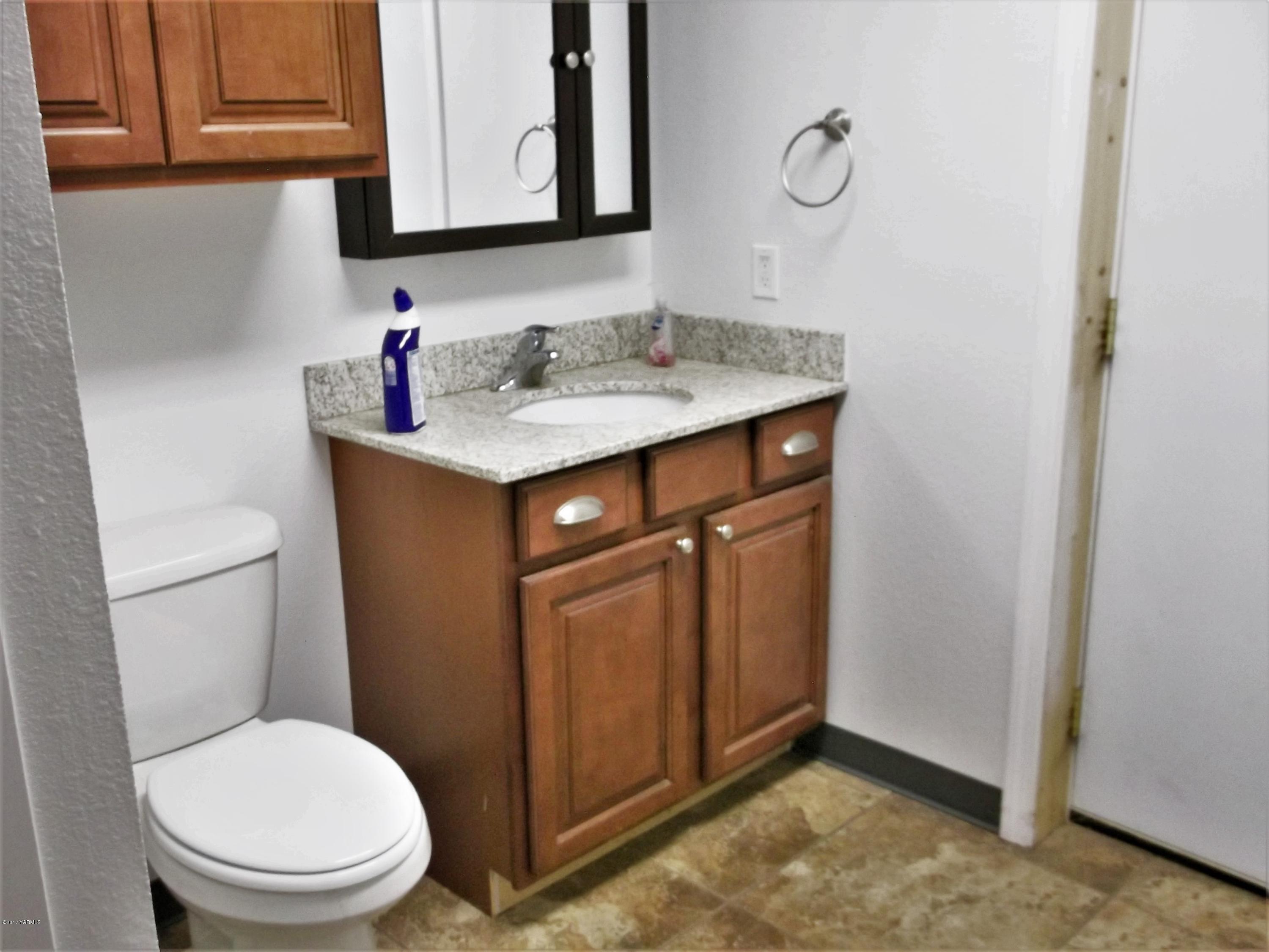 2000 Hornby Road Grandview, WA 98930 - Photo 31 of 45 a bathroom with a sink toilet and vanity