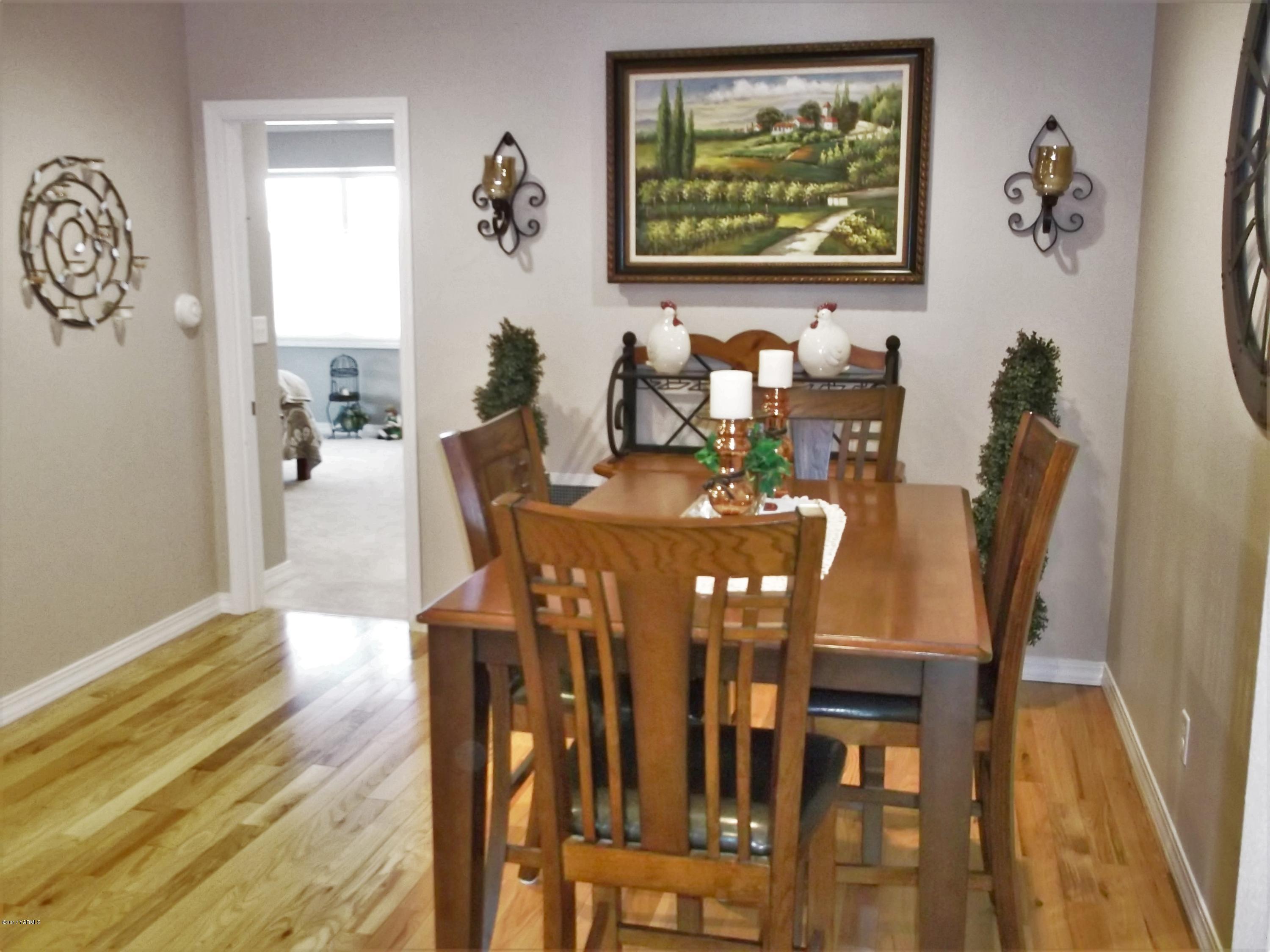 2000 Hornby Road Grandview, WA 98930 - Photo 6 of 45 a view of a dining room with furniture and wooden floor