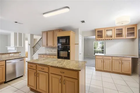 a kitchen with cabinets and a sink