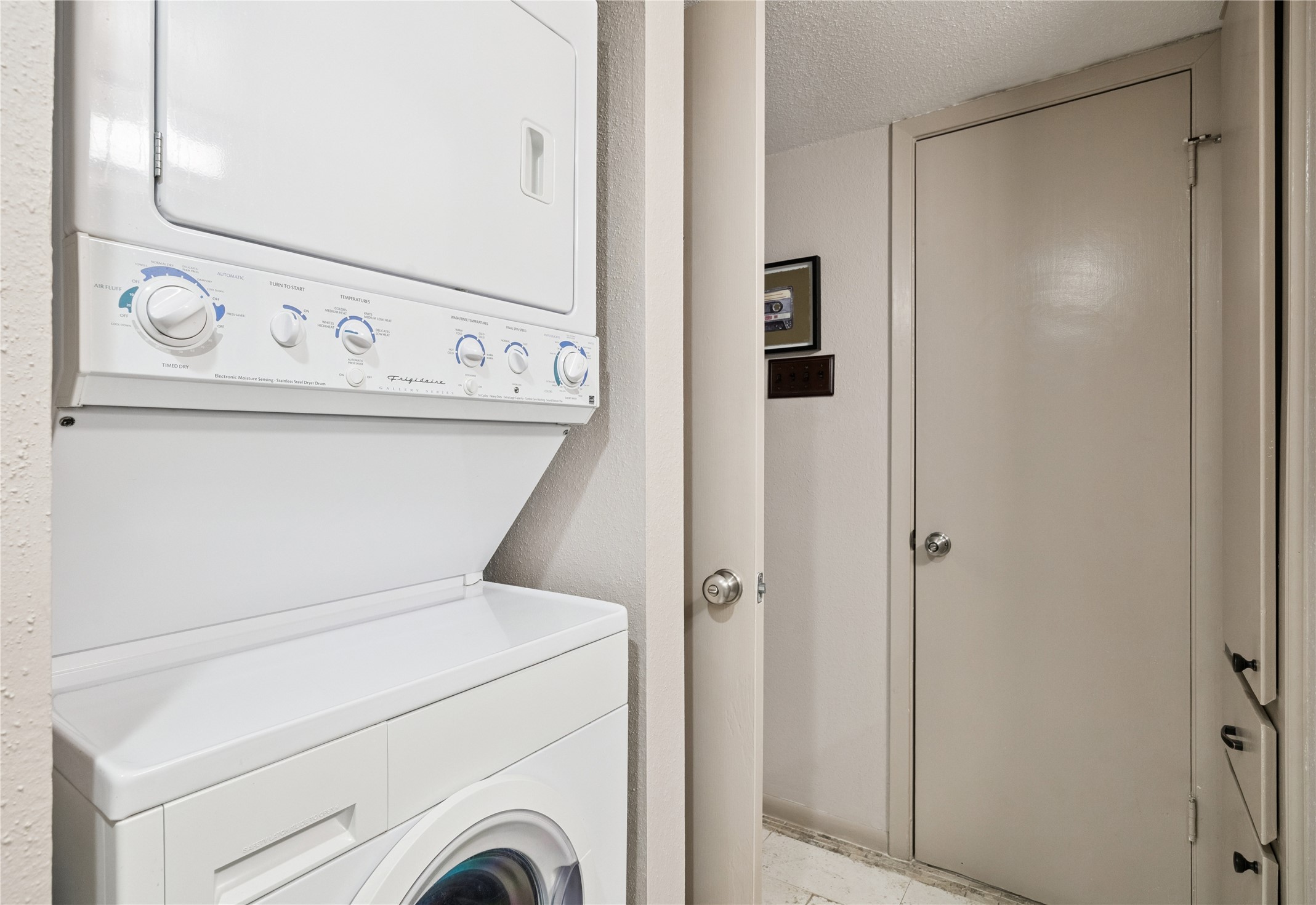 7555 Katy Freeway, Unit 50 Houston, TX 77024 - Photo 13 of 13 a utility room with dryer and washer