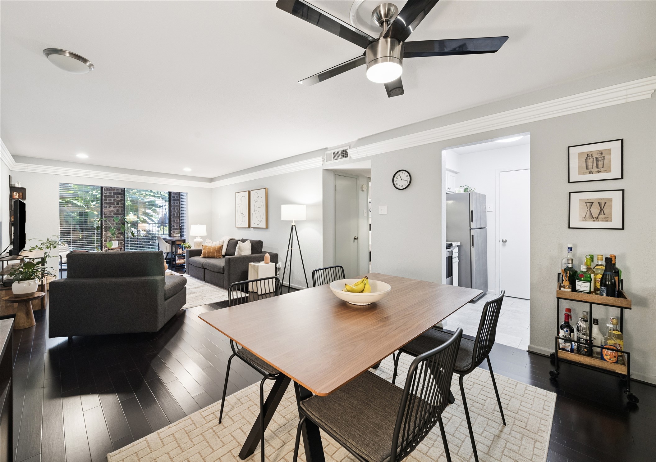 7555 Katy Freeway, Unit 50 Houston, TX 77024 - Photo 5 of 13 a view of a dining room with furniture and wooden floor