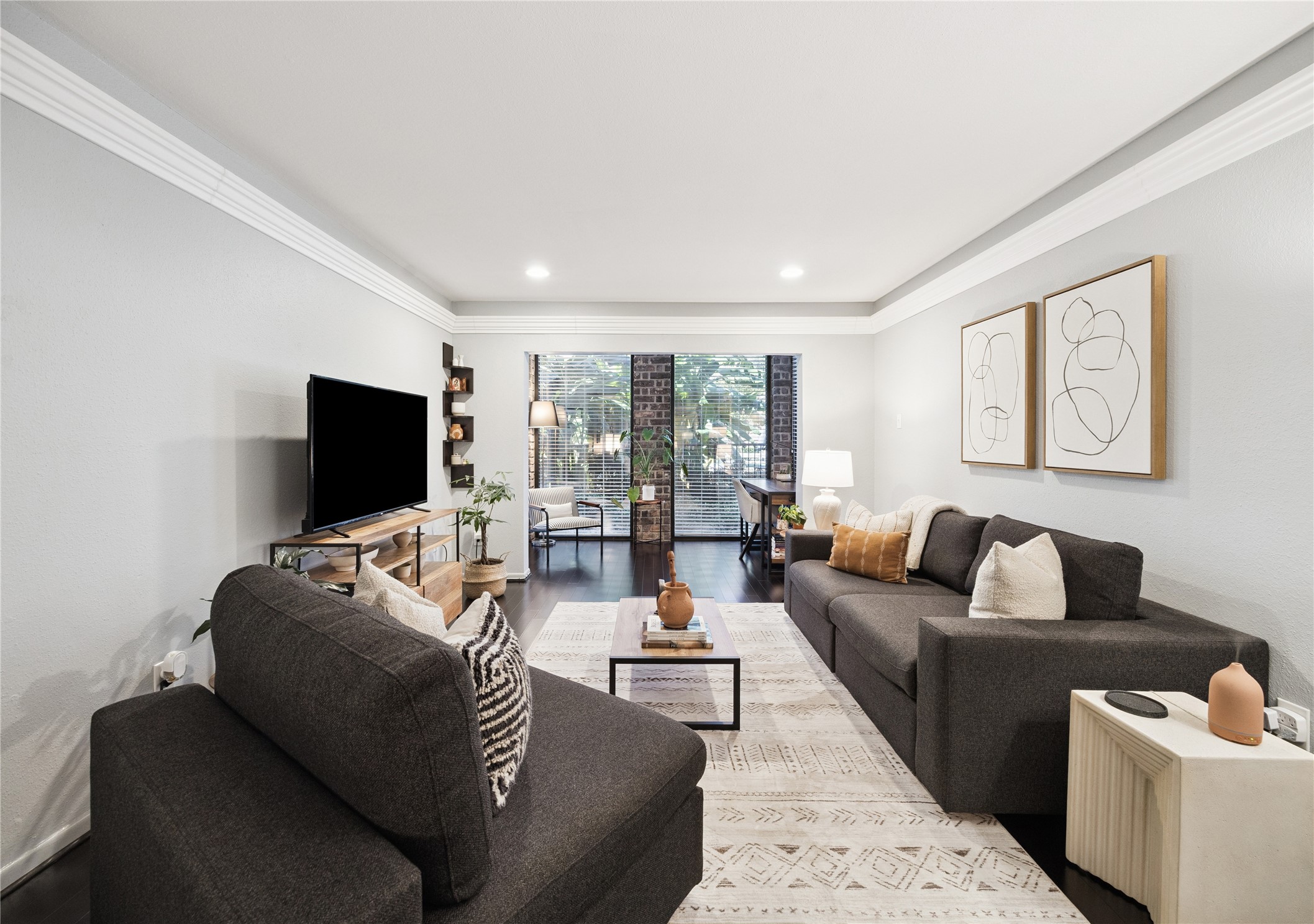 7555 Katy Freeway, Unit 50 Houston, TX 77024 - Photo 6 of 13 a living room with furniture and a flat screen tv