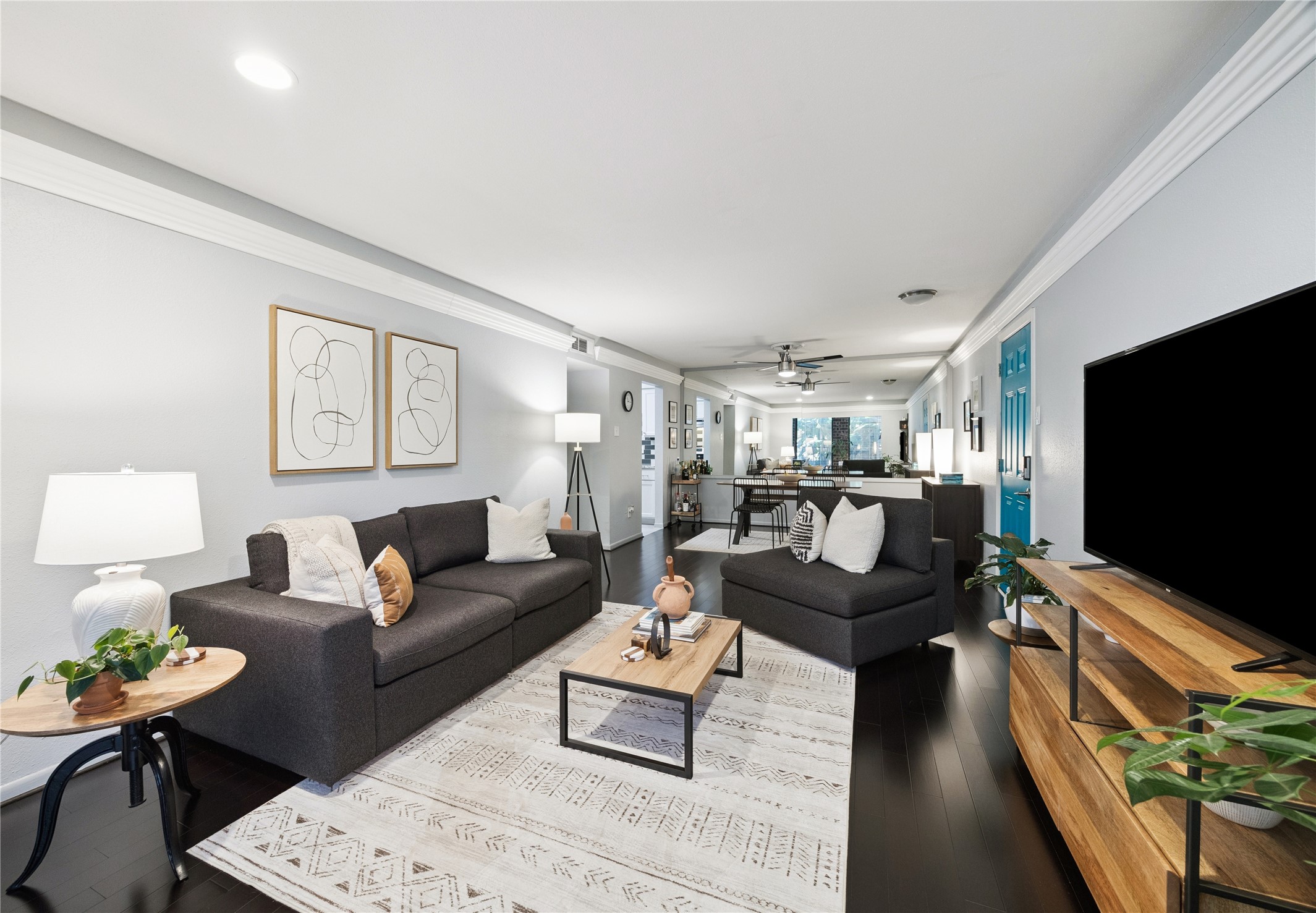 7555 Katy Freeway, Unit 50 Houston, TX 77024 - Photo 8 of 13 a living room with furniture and a flat screen tv