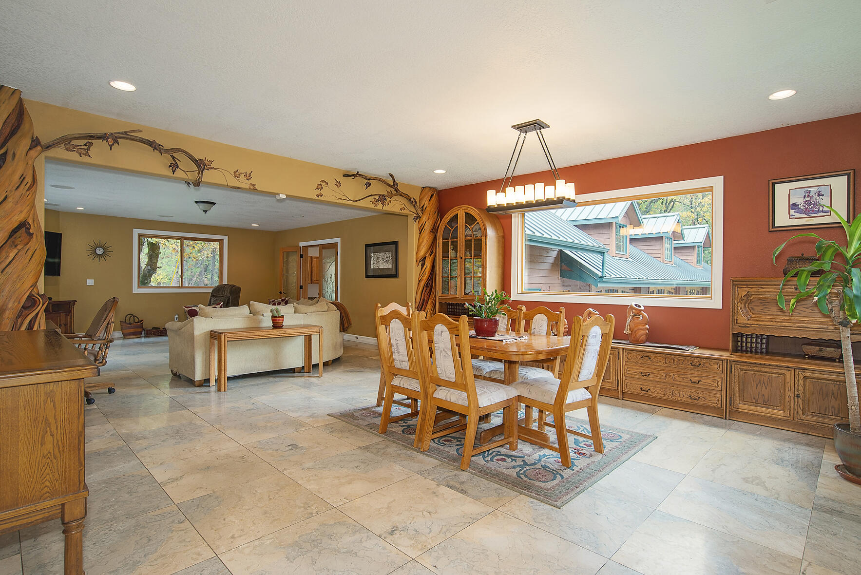 1665 Upper River Road Gold Hill, OR 97525 - Photo 12 of 48 a dining room with furniture and a floor to ceiling window
