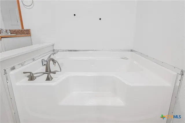 a close view of a bathtub in bathroom