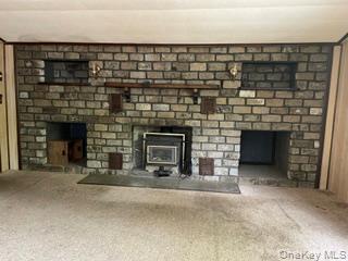 100 Decker Road, Unit 2 Wallkill, NY 12589 - Photo 15 of 23 a living room with a fireplace