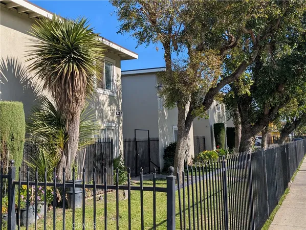 a view of a house with a small yard
