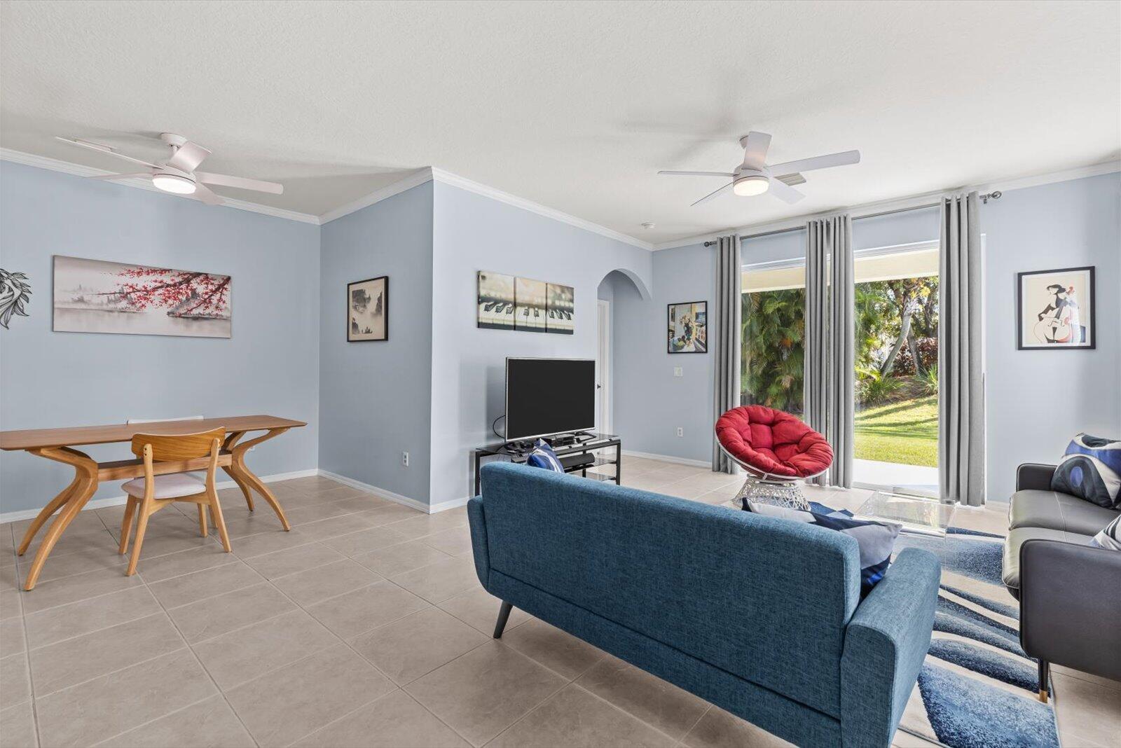 311 Southwest Coconut Key Way Port St. Lucie, FL 34986 - Photo 12 of 25 a living room with furniture and a flat screen tv