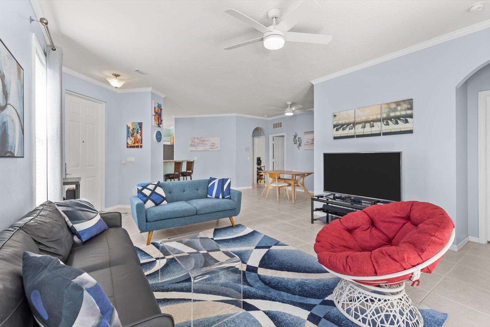 311 Southwest Coconut Key Way Port St. Lucie, FL 34986 - Photo 14 of 25 a living room with furniture and a flat screen tv