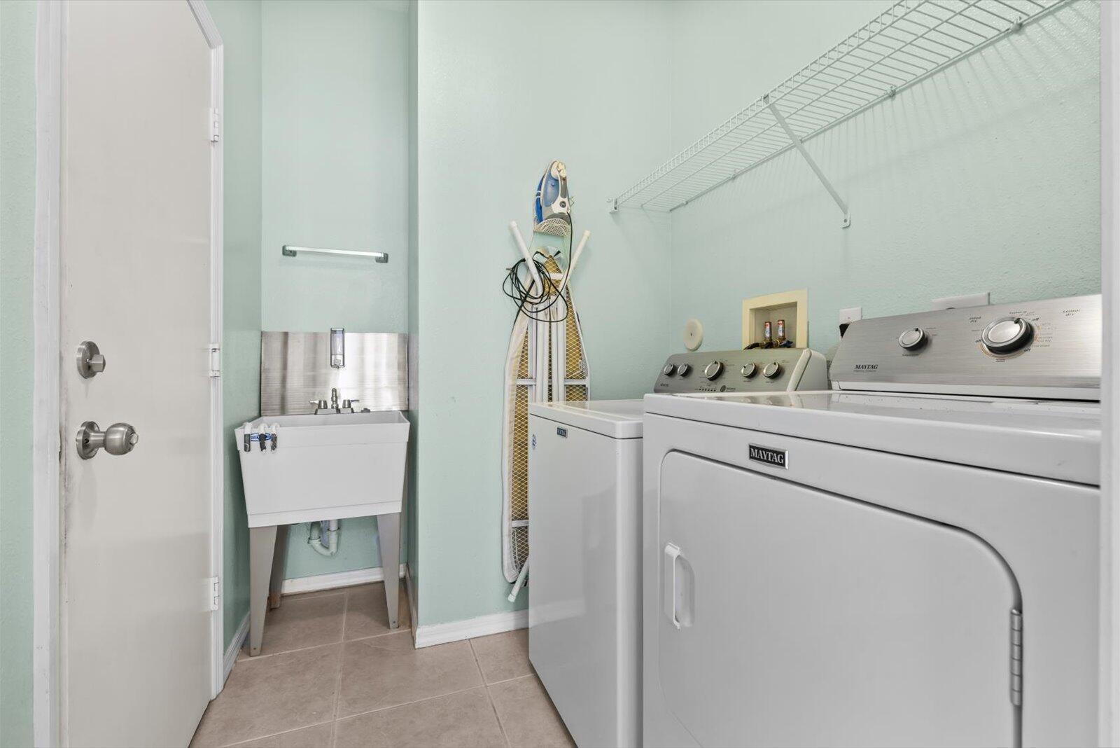 311 Southwest Coconut Key Way Port St. Lucie, FL 34986 - Photo 23 of 25 a utility room with dryer and washer