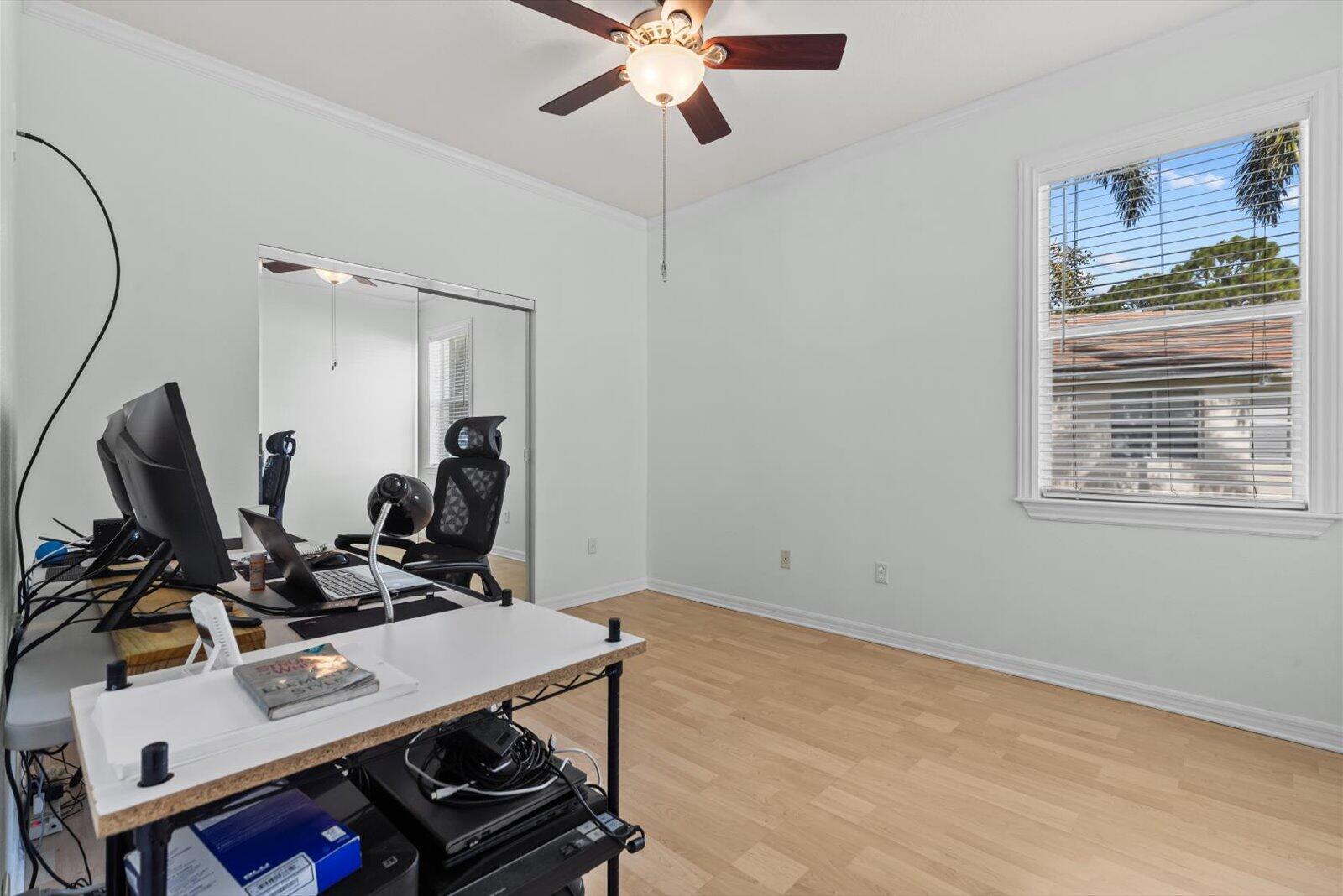 311 Southwest Coconut Key Way Port St. Lucie, FL 34986 - Photo 24 of 25 a room with furniture and gym equipment