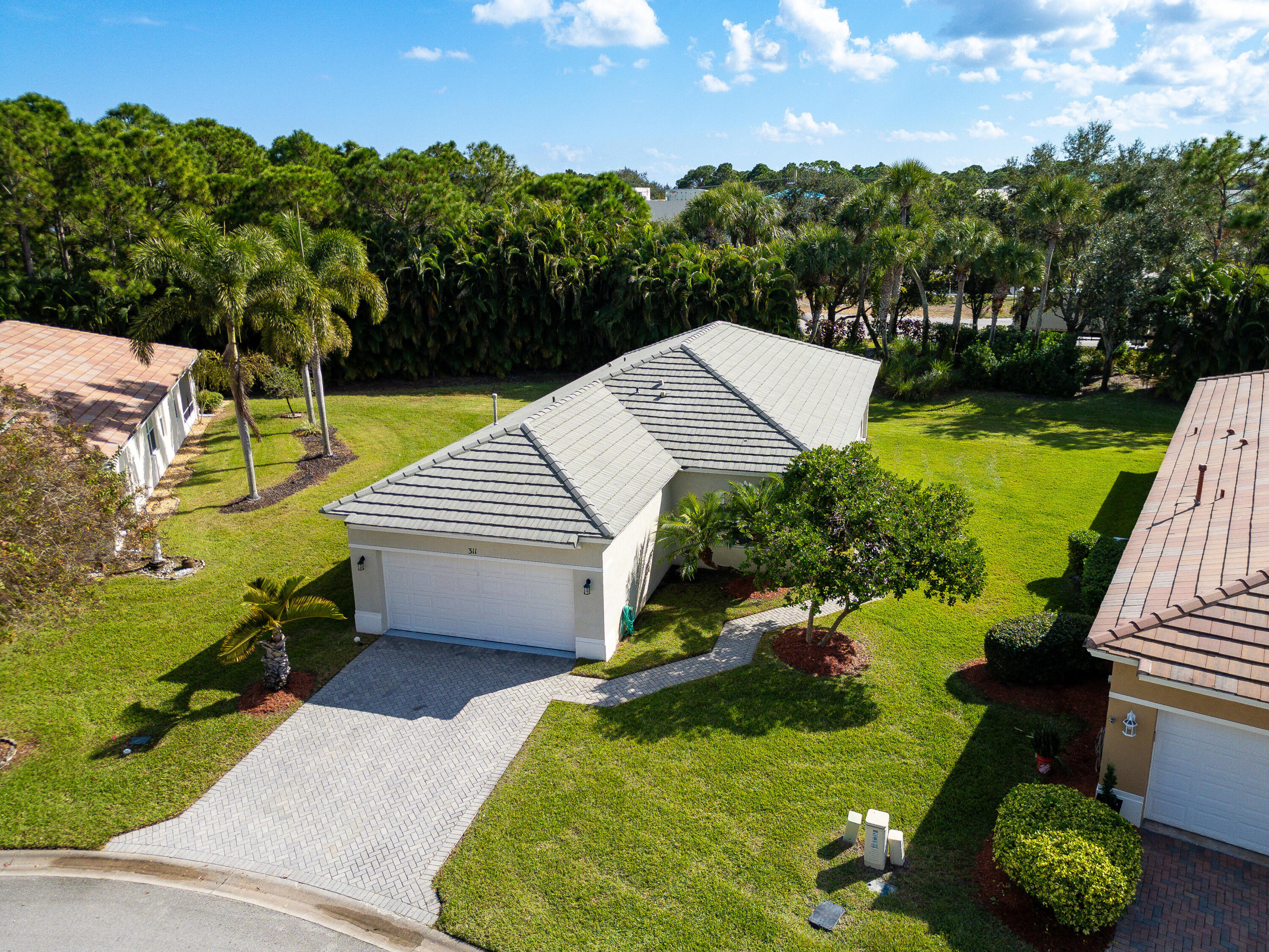 311 Southwest Coconut Key Way Port St. Lucie, FL 34986 - Photo 3 of 25 an aerial view of a house with a yard
