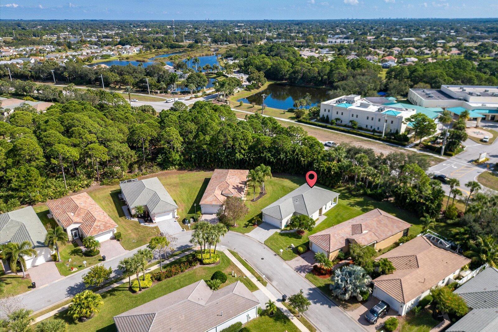 311 Southwest Coconut Key Way Port St. Lucie, FL 34986 - Photo 4 of 25 an aerial view of house with yard swimming pool and outdoor seating