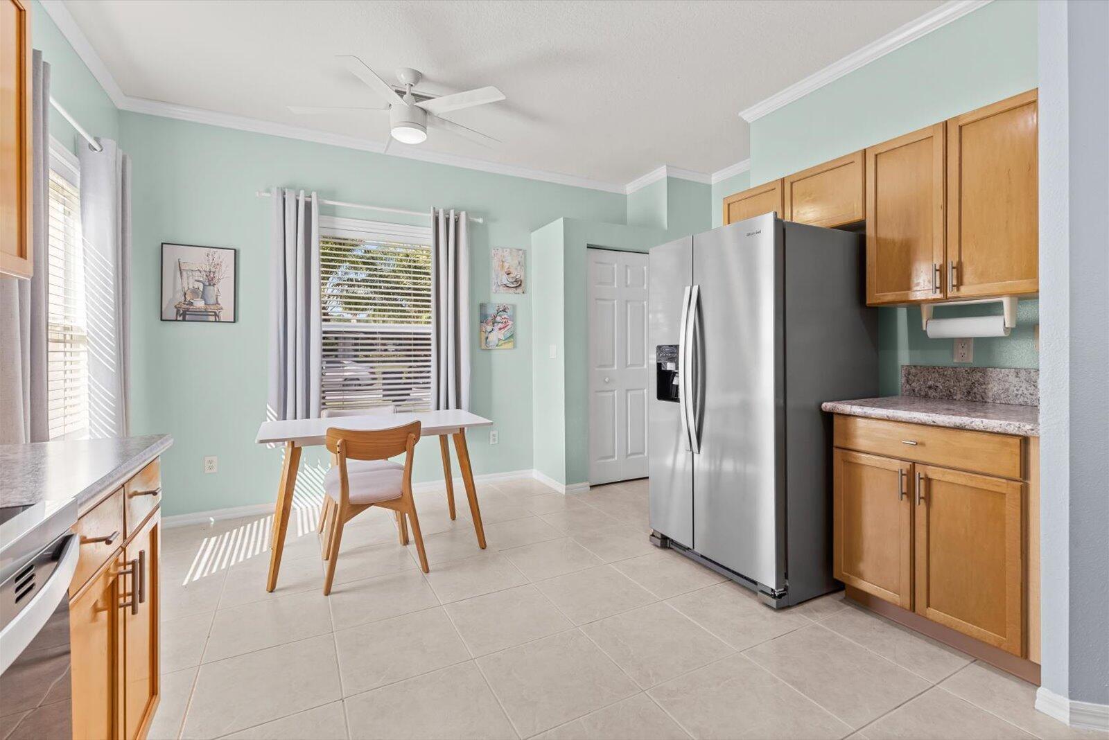 311 Southwest Coconut Key Way Port St. Lucie, FL 34986 - Photo 9 of 25 a dining room with stainless steel appliances granite countertop furniture and a window