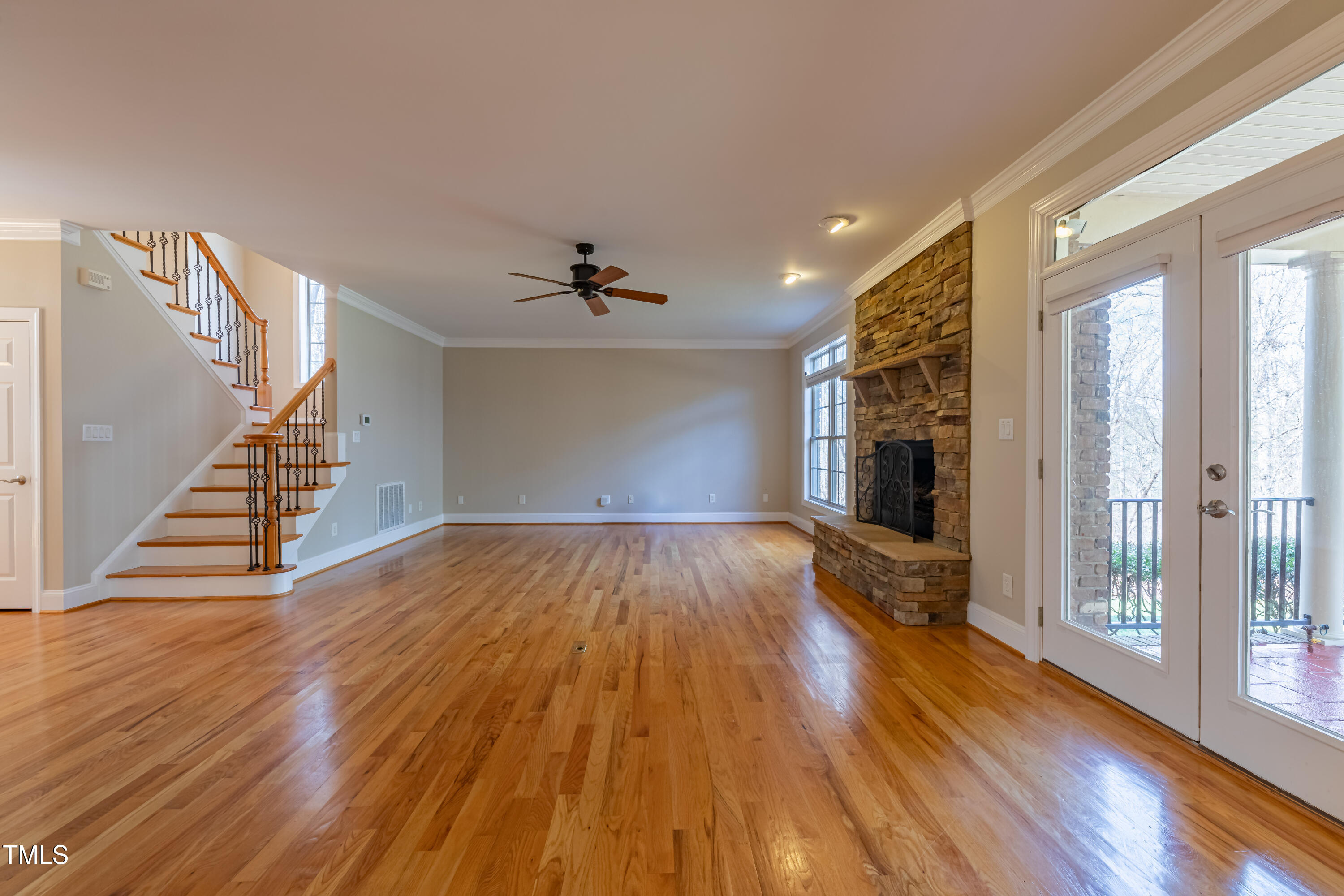 1408 Goldengate Court Raleigh, NC 27613 - Photo 12 of 64 a view of empty room with wooden floor and fan