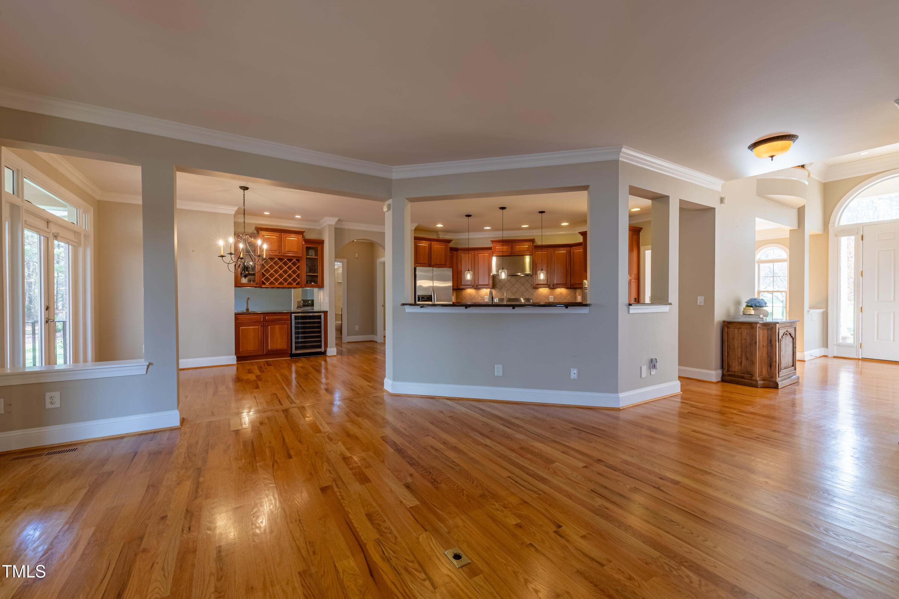 1408 Goldengate Court Raleigh, NC 27613 - Photo 13 of 64 wooden floor in an empty room with a window