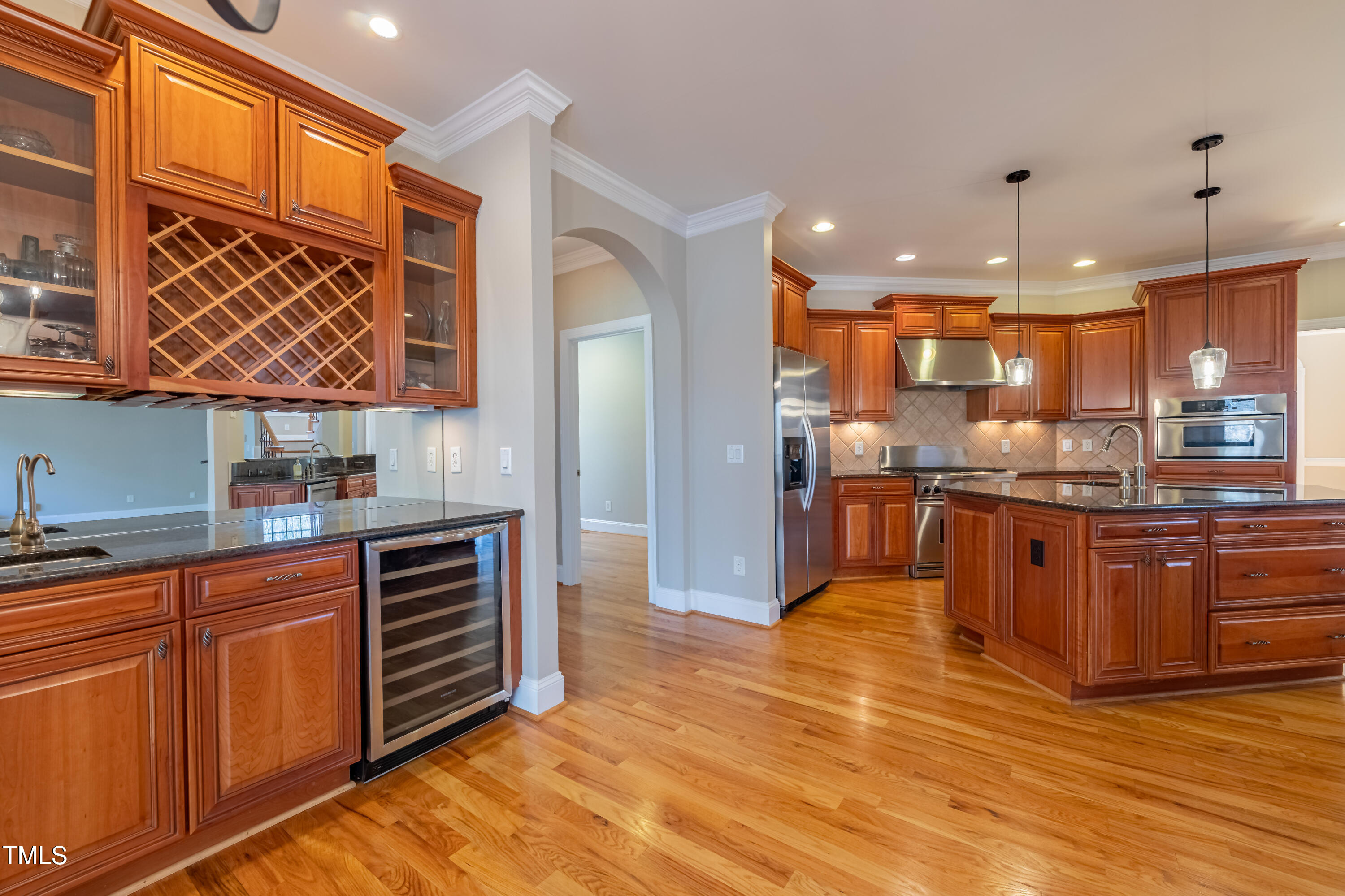 1408 Goldengate Court Raleigh, NC 27613 - Photo 14 of 64 a kitchen with stainless steel appliances granite countertop a stove a sink and a microwave