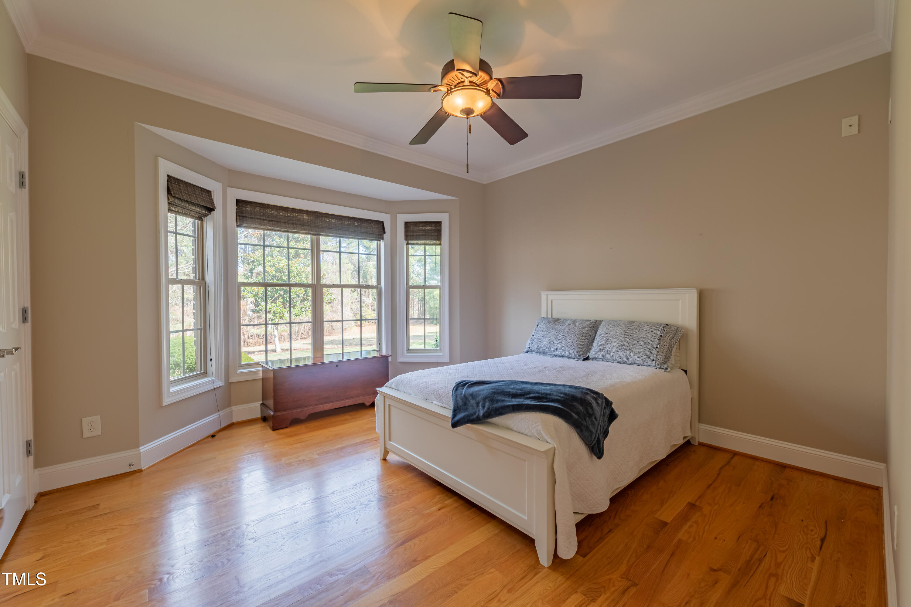 1408 Goldengate Court Raleigh, NC 27613 - Photo 23 of 64 a spacious bedroom with a bed couch and a chandelier