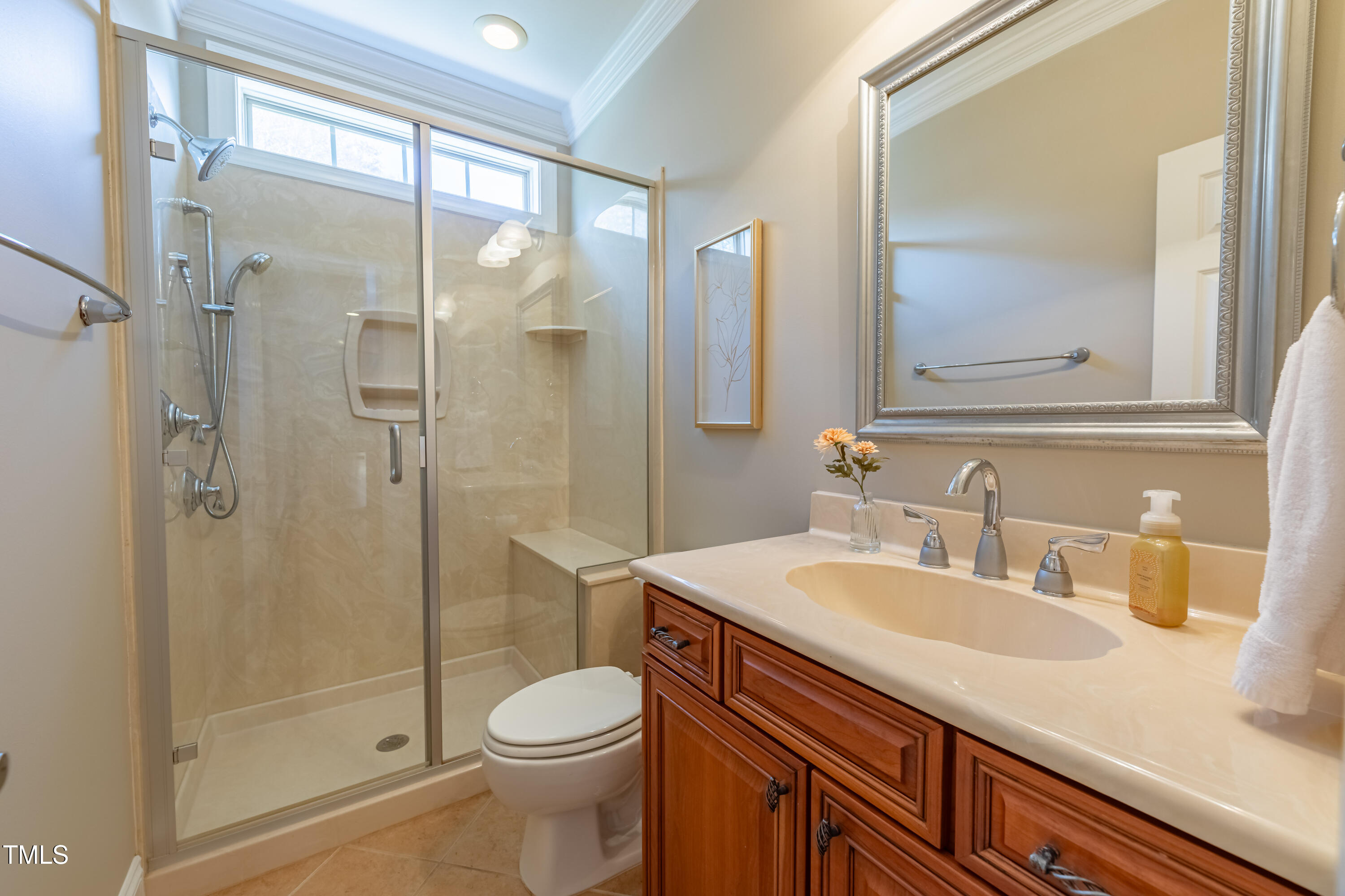 1408 Goldengate Court Raleigh, NC 27613 - Photo 25 of 64 a bathroom with a sink a toilet and shower