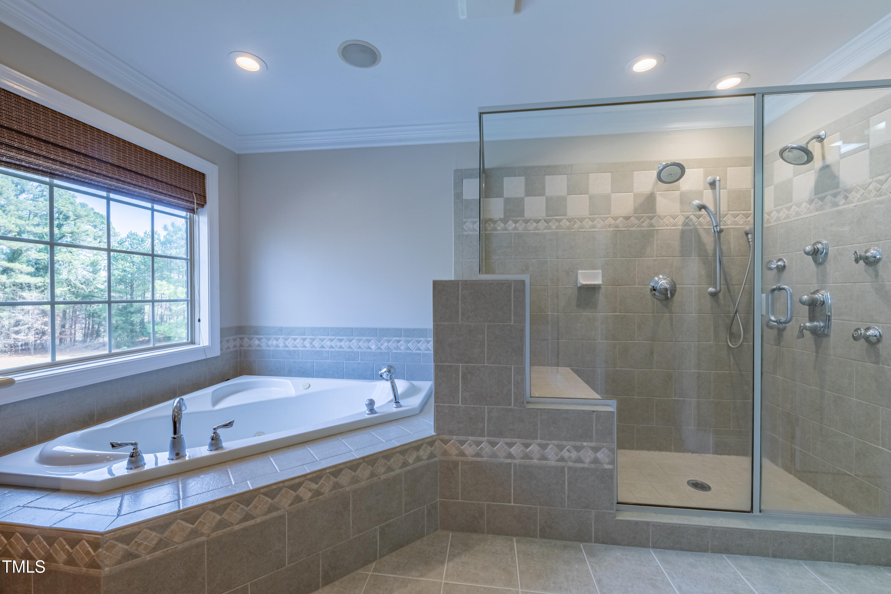 1408 Goldengate Court Raleigh, NC 27613 - Photo 32 of 64 a bathroom with a tub and a shower