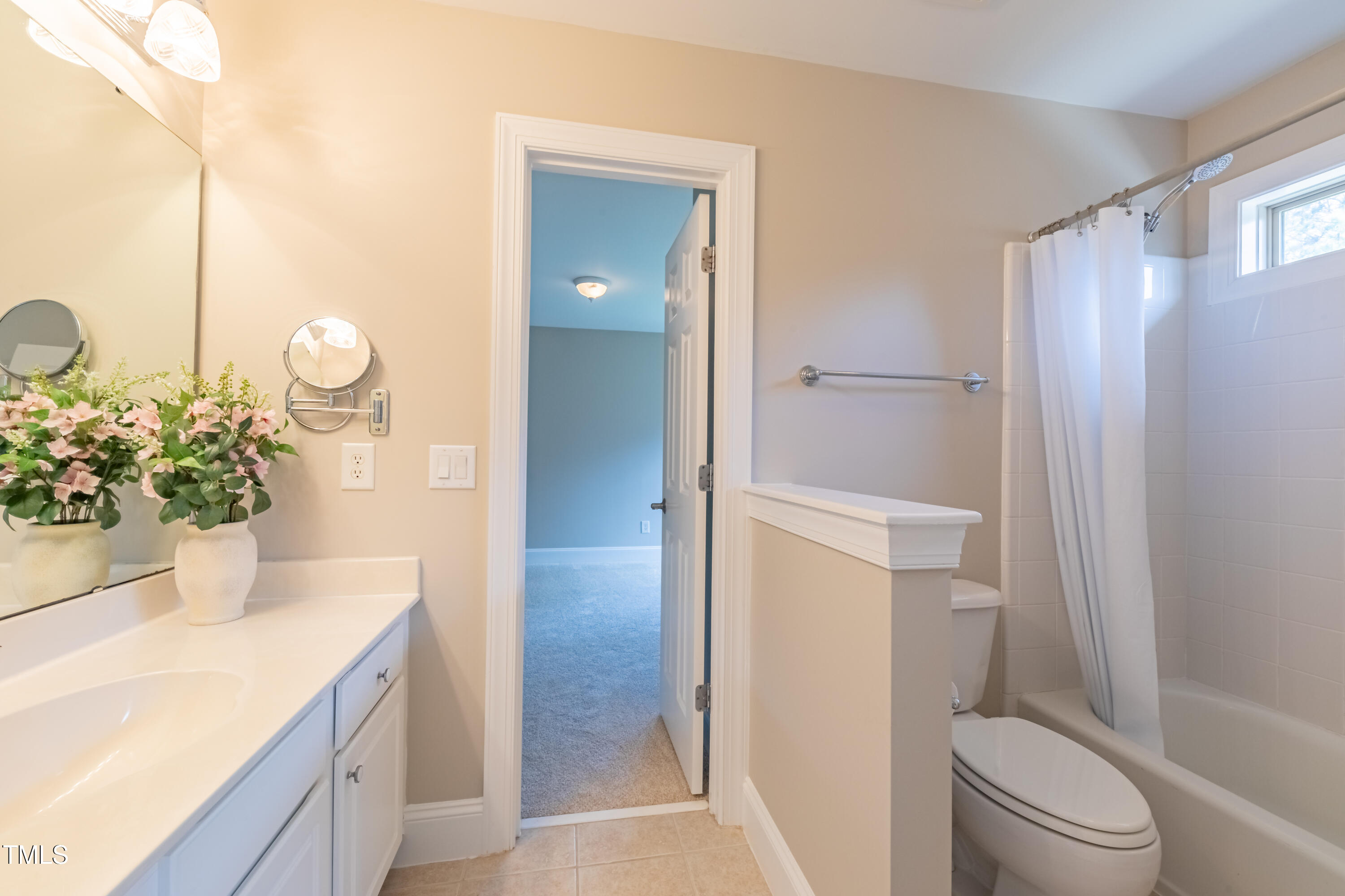 1408 Goldengate Court Raleigh, NC 27613 - Photo 42 of 64 a bathroom with a granite countertop sink toilet and shower