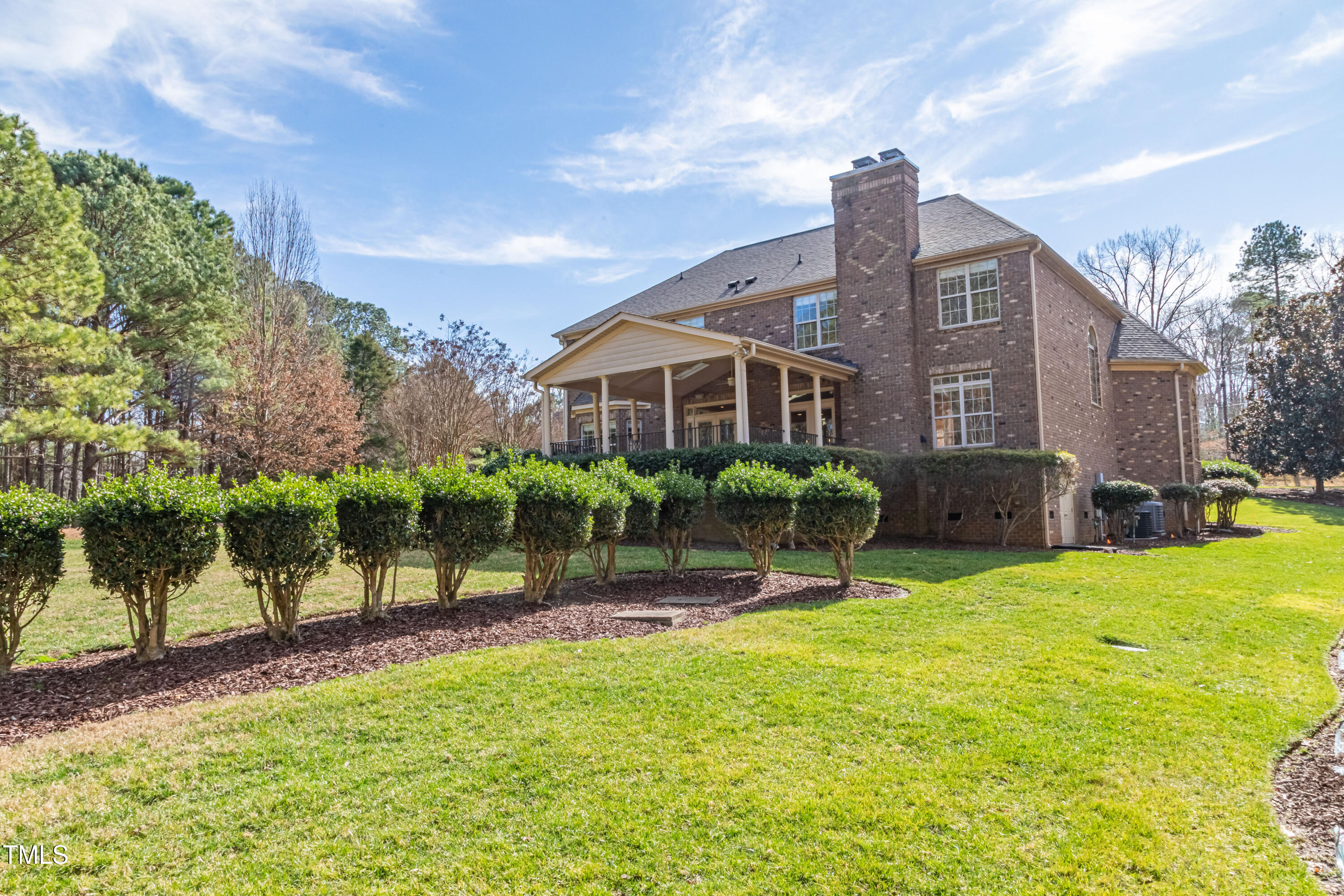 1408 Goldengate Court Raleigh, NC 27613 - Photo 53 of 64 a view of a house with a yard porch and sitting area