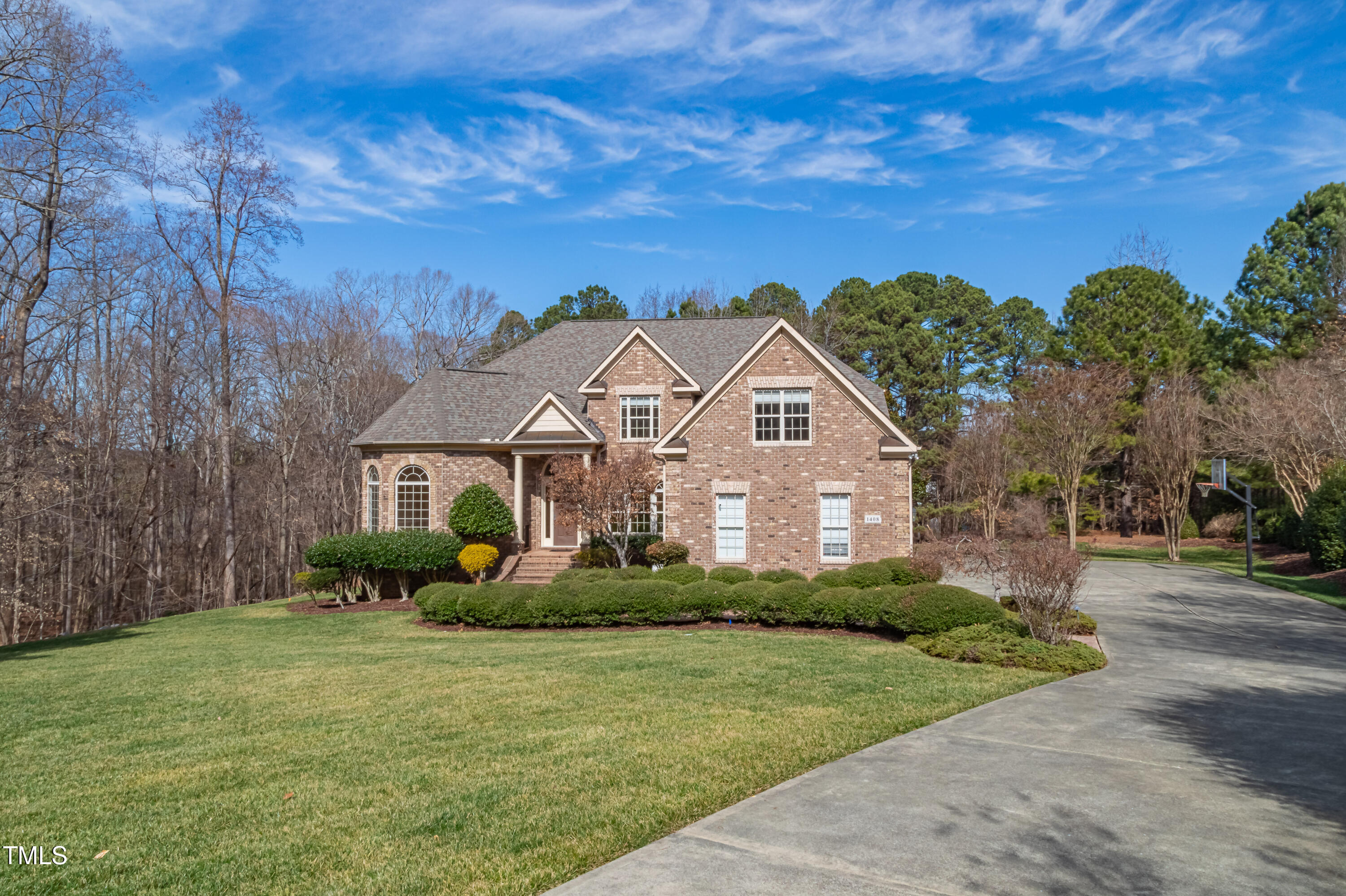 1408 Goldengate Court Raleigh, NC 27613 - Photo 54 of 64 a front view of a house with a garden