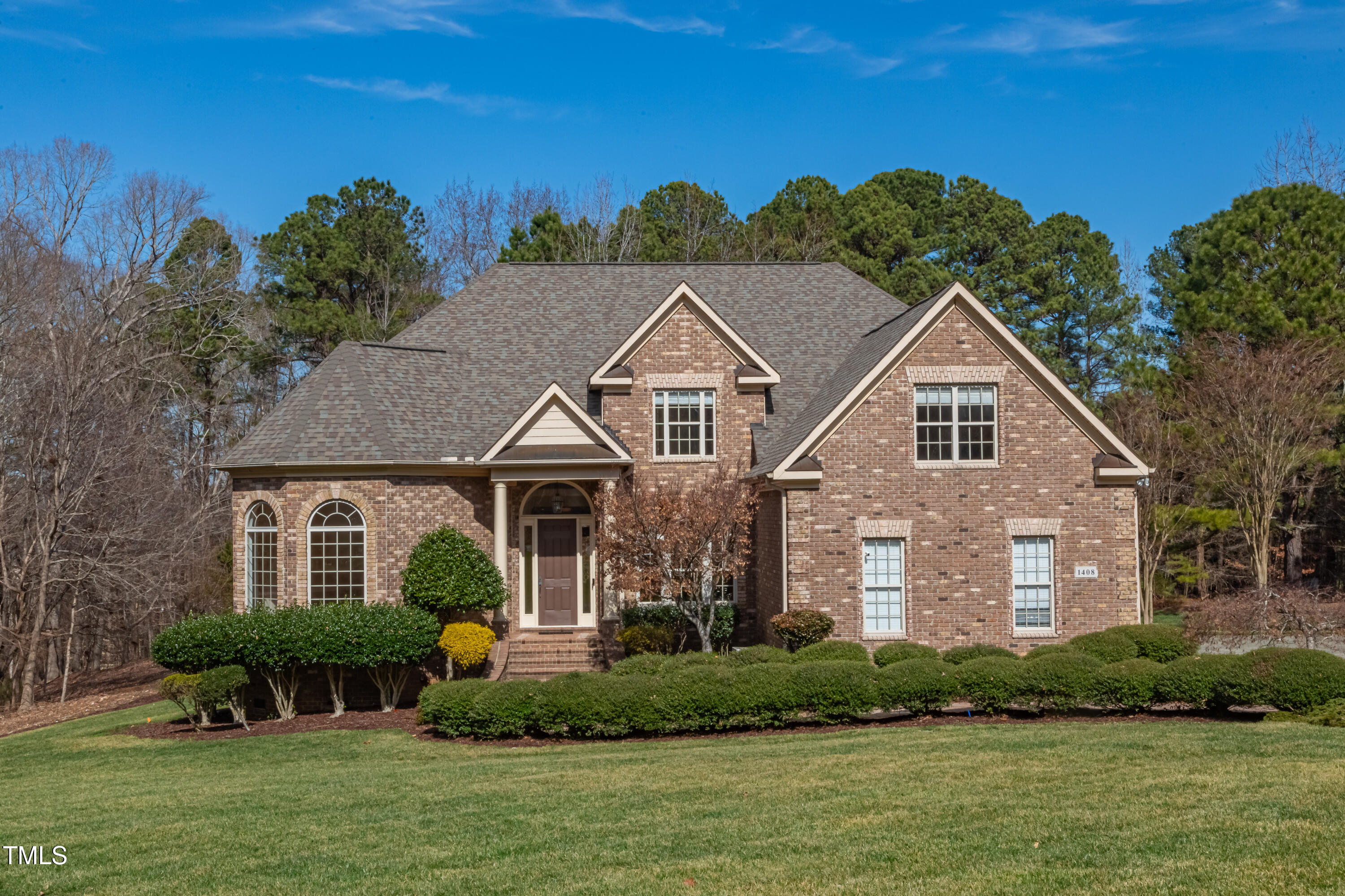 1408 Goldengate Court Raleigh, NC 27613 - Photo 55 of 64 a front view of a house with a yard