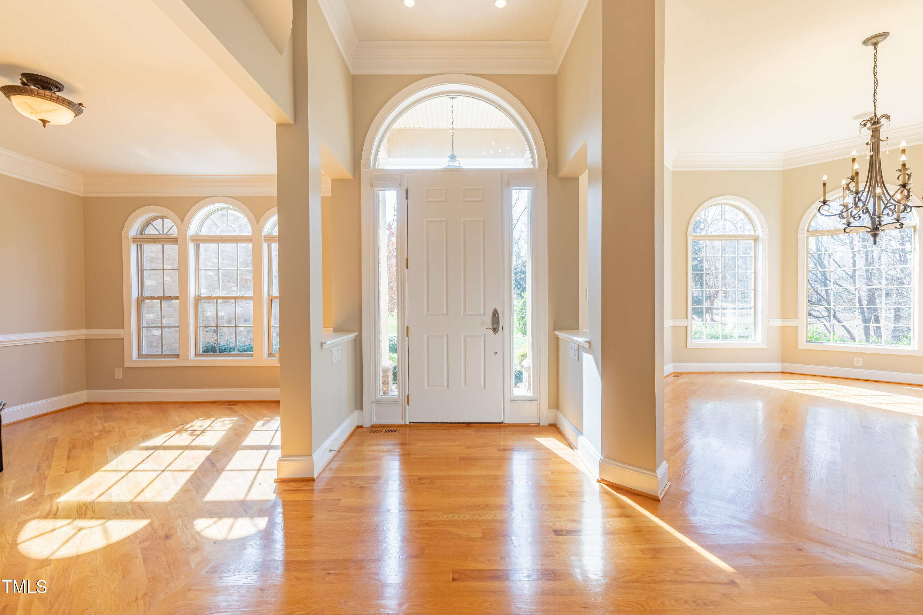1408 Goldengate Court Raleigh, NC 27613 - Photo 4 of 64 a view of empty room with wooden floor and fan