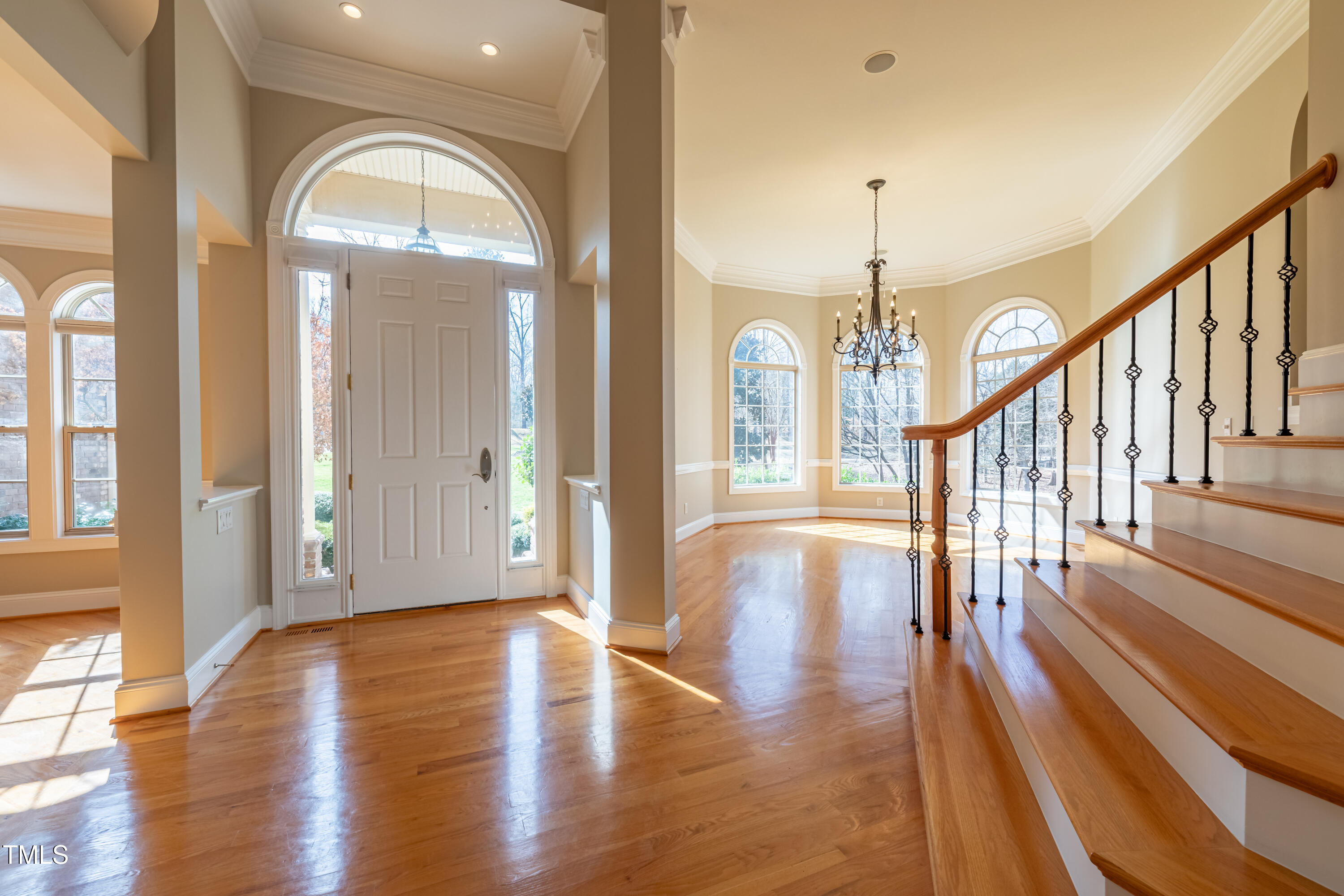 1408 Goldengate Court Raleigh, NC 27613 - Photo 5 of 64 a view of a hallway with wooden floor and stairs