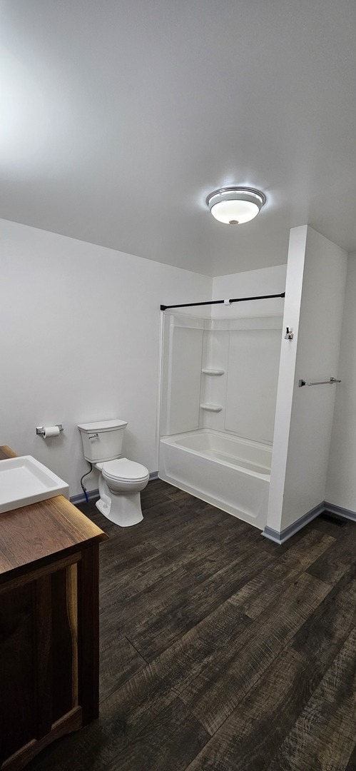 104 North Main Street, Unit C Princeton, IL 61356 - Photo 9 of 12 a bathroom with a sink and a toilet
