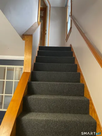 a view of stairs and wooden floor