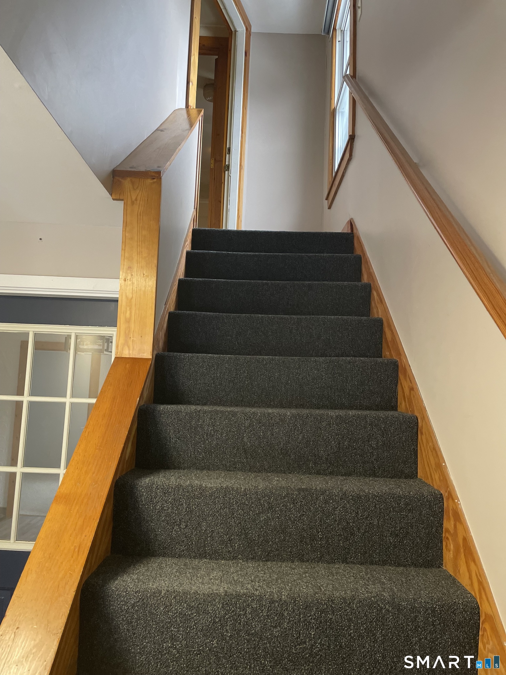 91 Division Street Ansonia, CT 06401 - Photo 12 of 22 a view of stairs and wooden floor