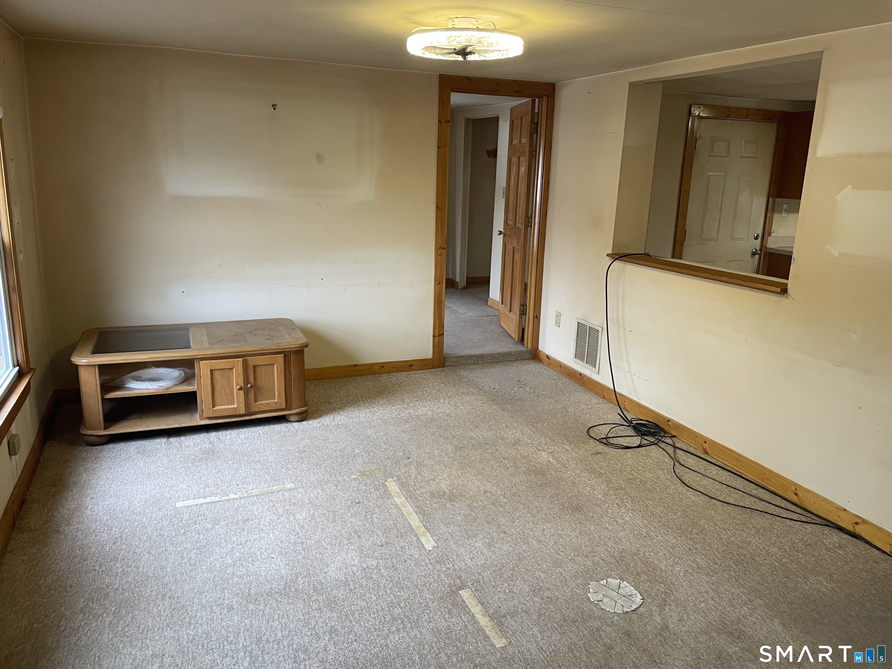 91 Division Street Ansonia, CT 06401 - Photo 18 of 22 an empty room with wooden floor and windows