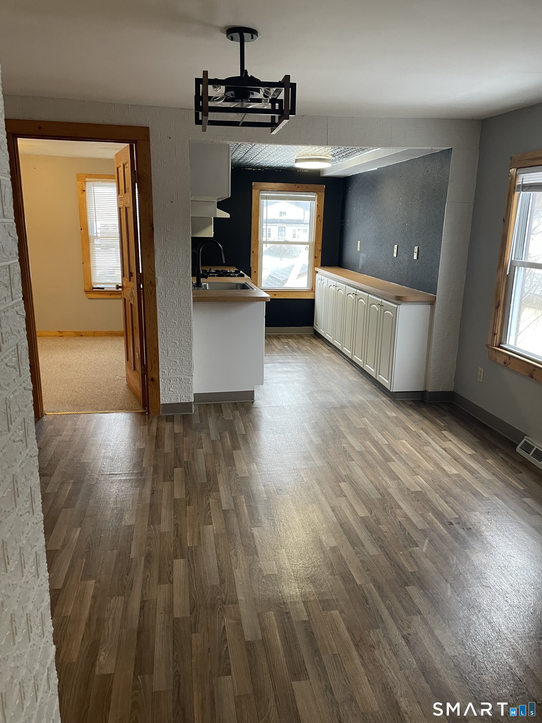91 Division Street Ansonia, CT 06401 - Photo 6 of 22 a view of a kitchen from a hallway