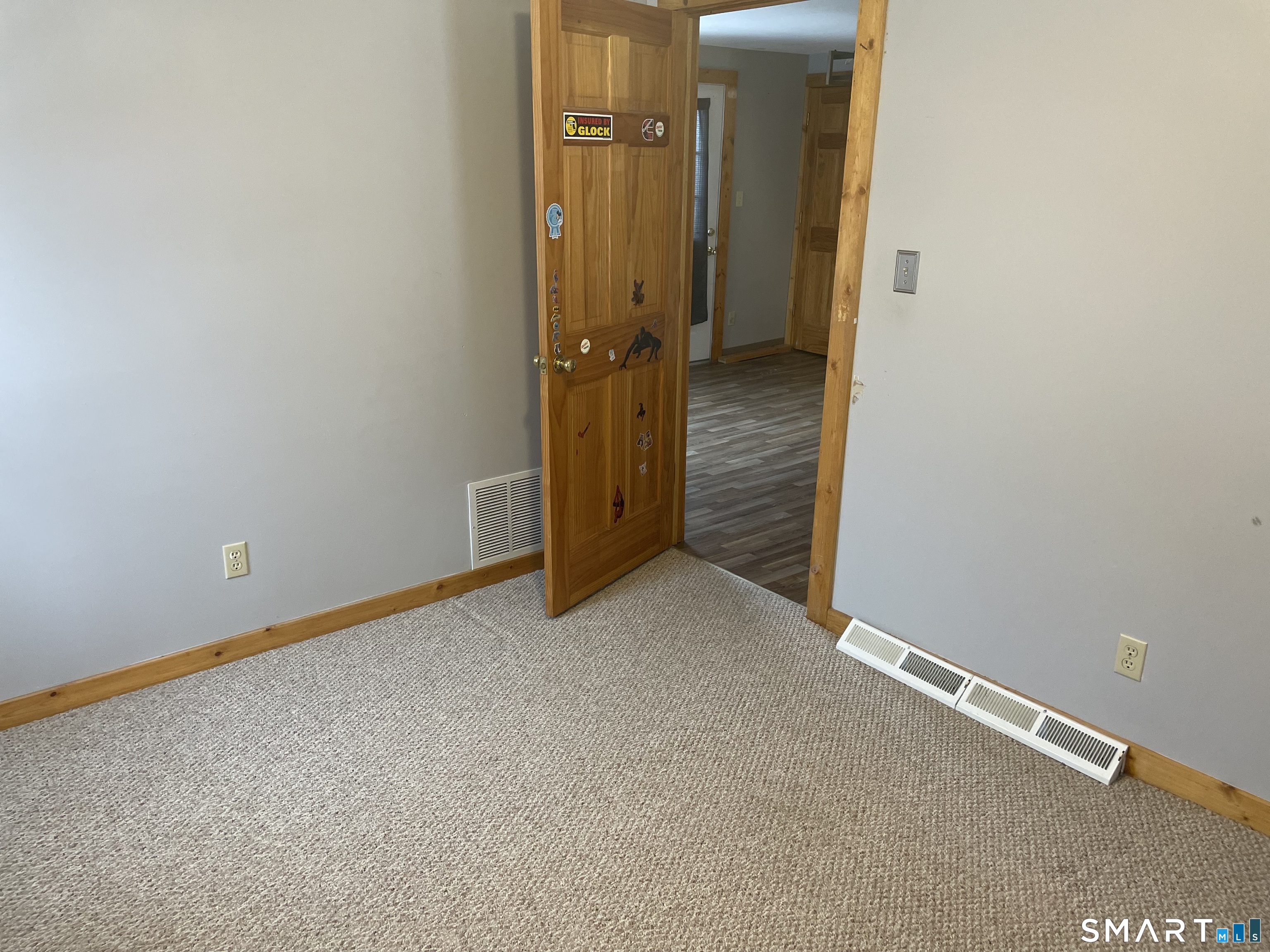 91 Division Street Ansonia, CT 06401 - Photo 10 of 22 an empty room with a mirror