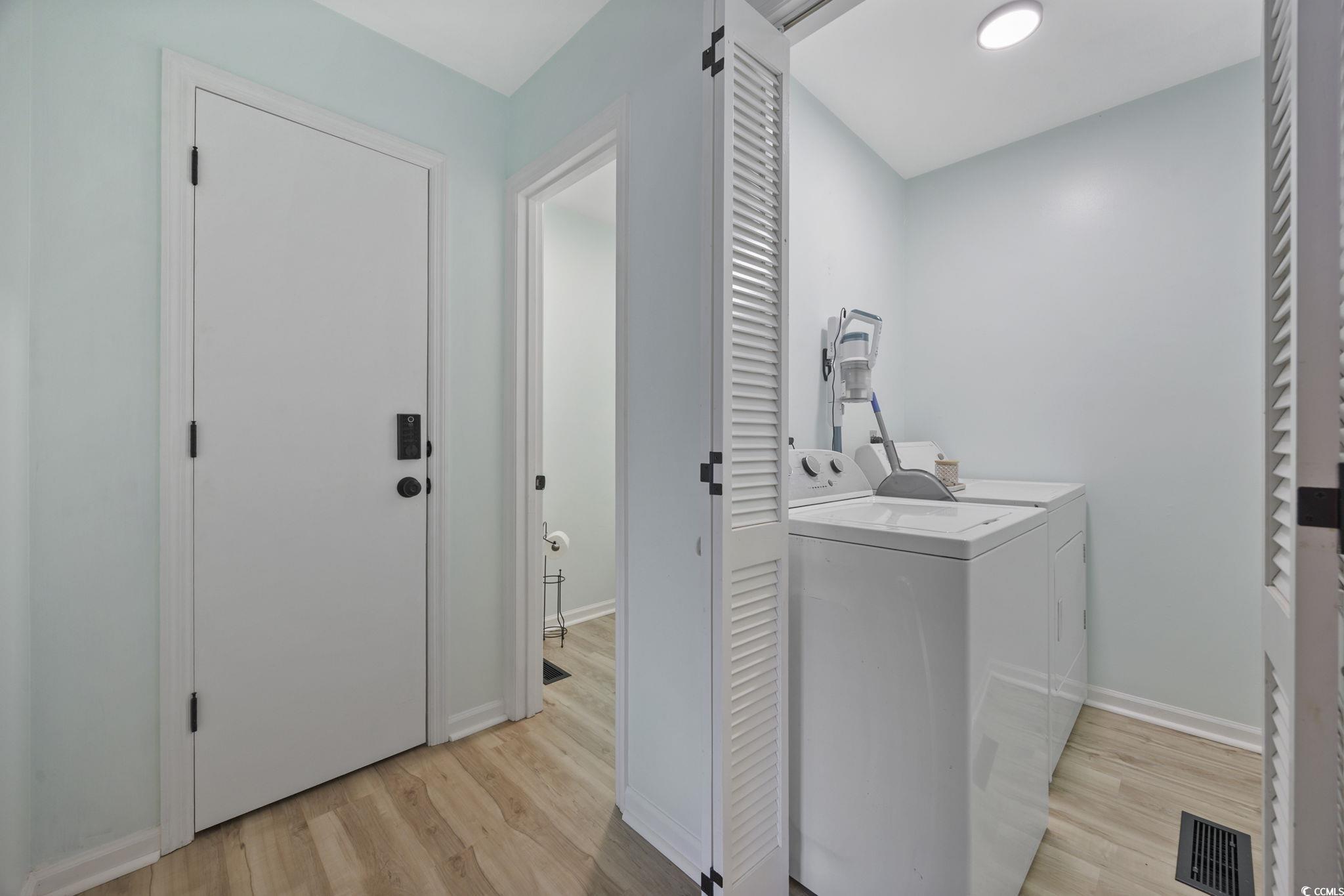 787 Causey Road Murrells Inlet, SC 29576 - Photo 12 of 40 Laundry room featuring light wood-type flooring and independent washer and dryer