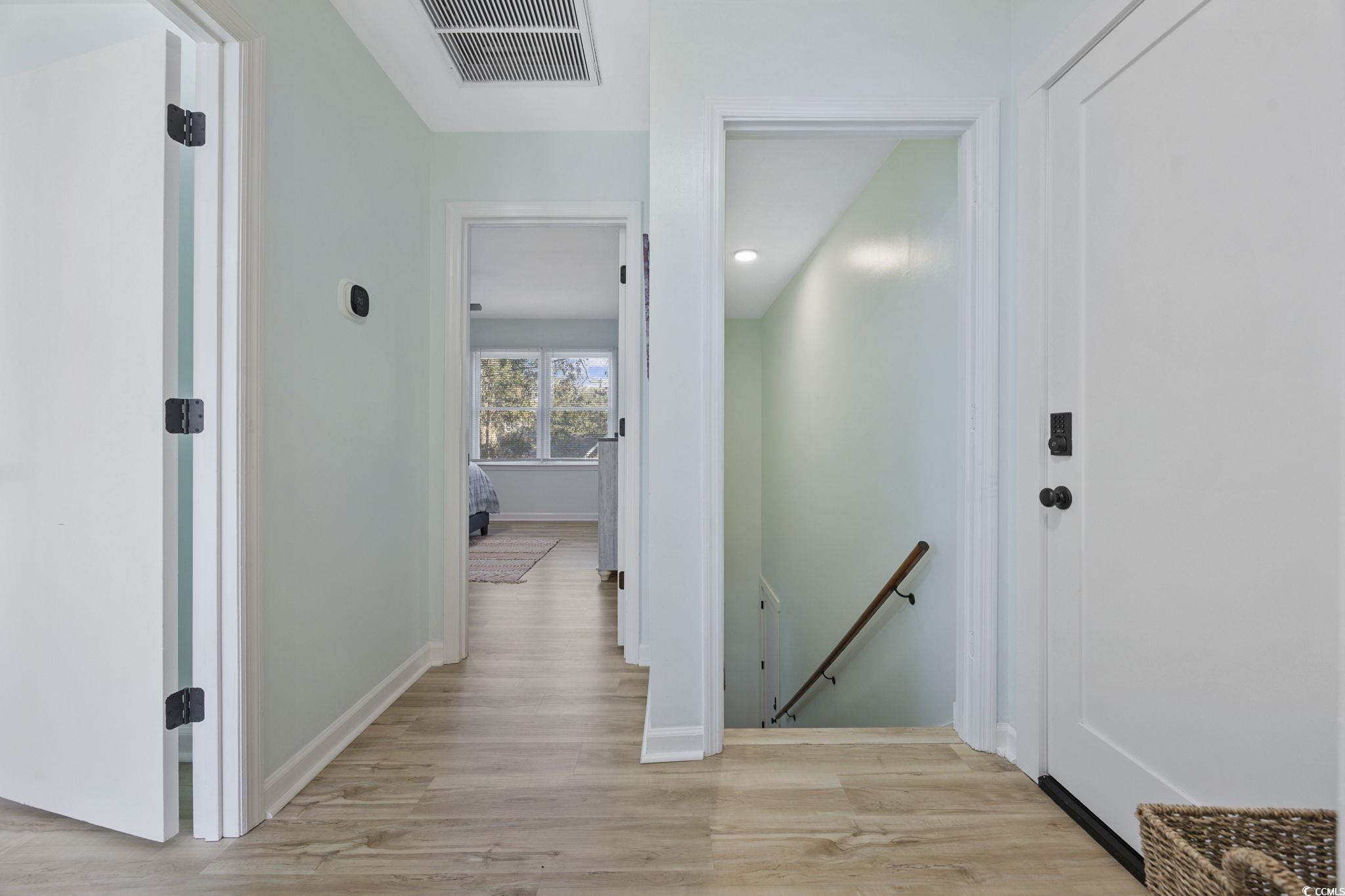 787 Causey Road Murrells Inlet, SC 29576 - Photo 15 of 40 Hall featuring an upstairs landing and light wood finished floors