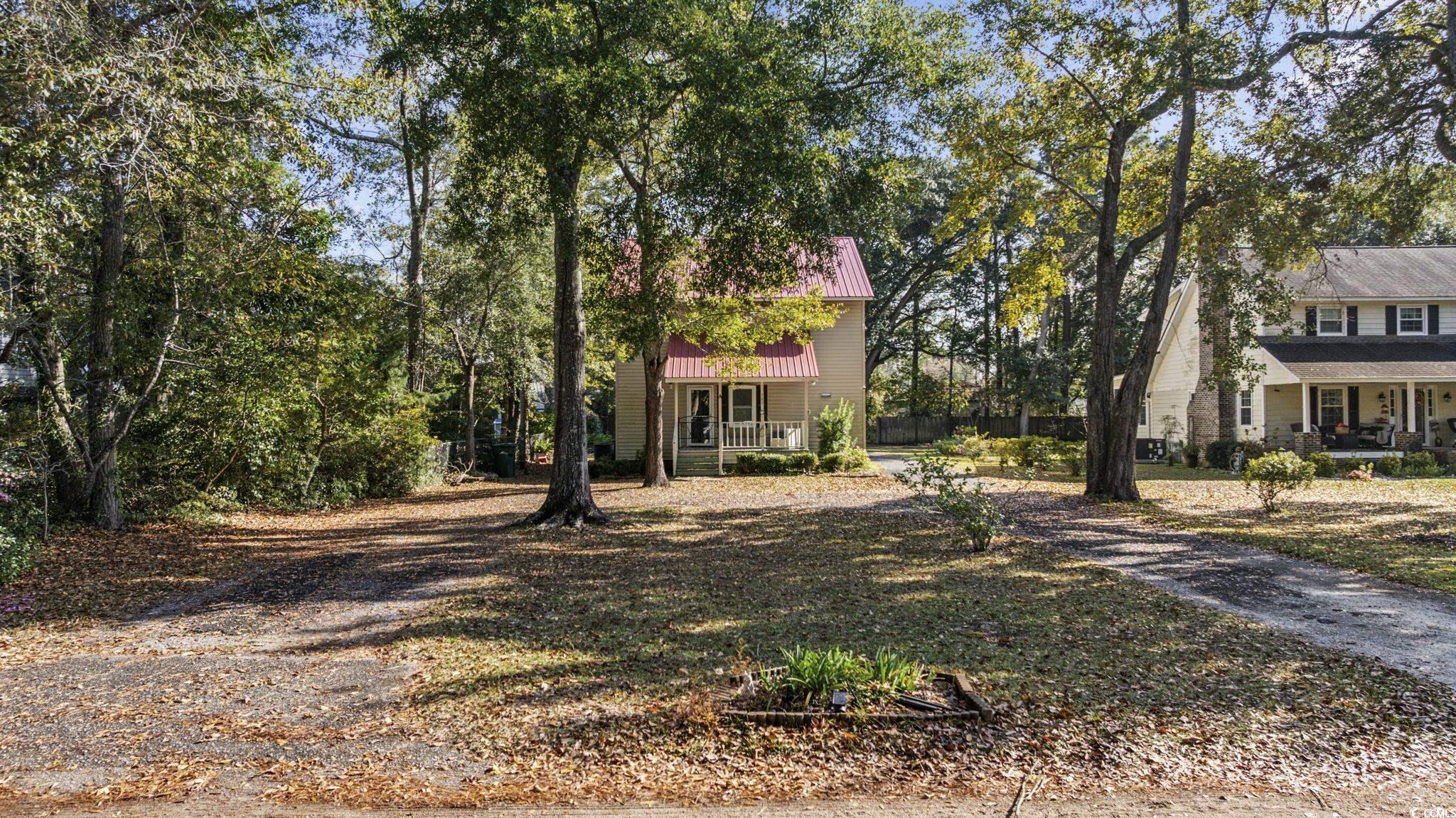 787 Causey Road Murrells Inlet, SC 29576 - Photo 2 of 40 View of front of property featuring covered porch and a metal roof