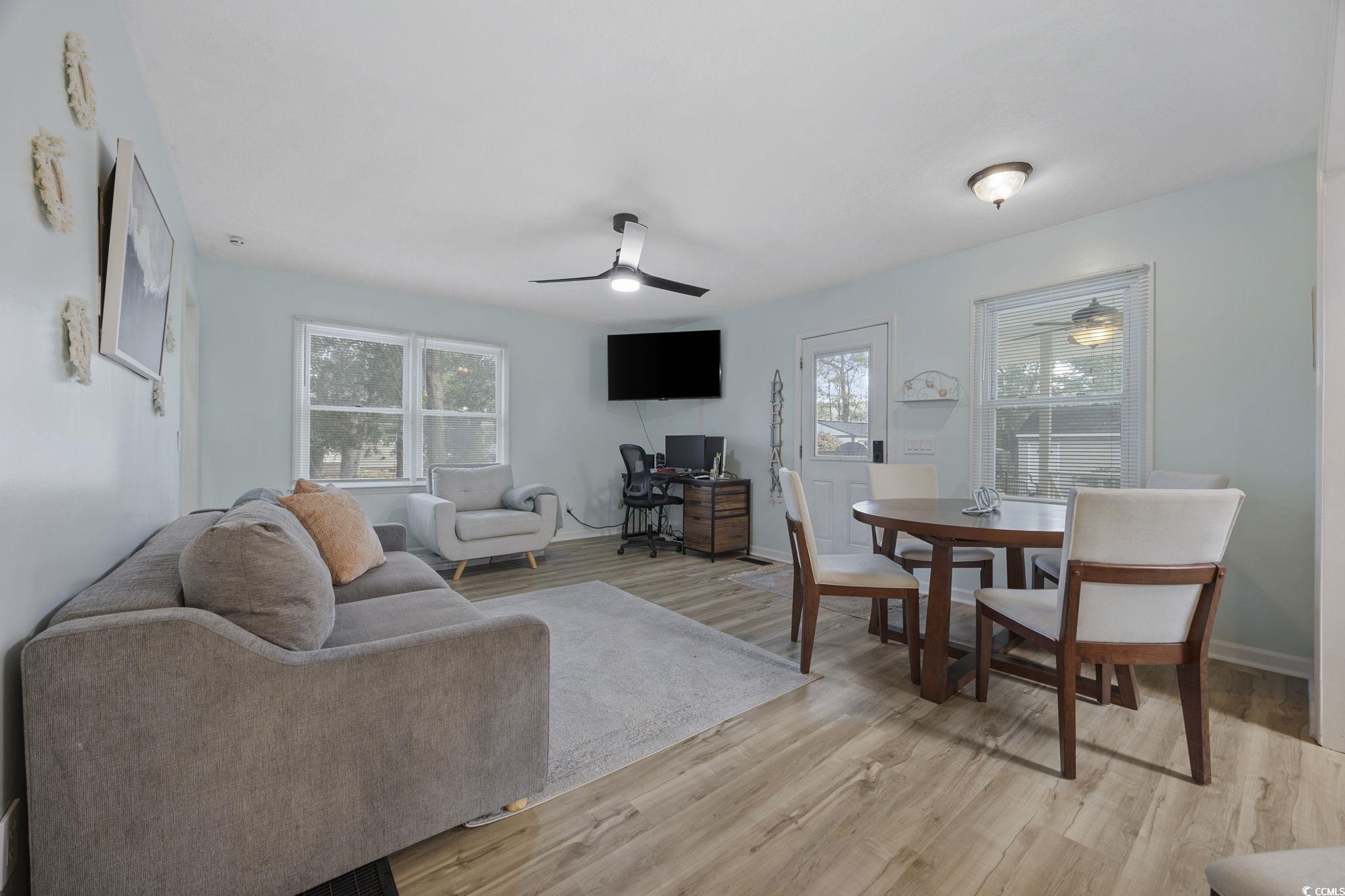 787 Causey Road Murrells Inlet, SC 29576 - Photo 24 of 40 Living area featuring a ceiling fan, light wood finished floors, and healthy amount of natural light
