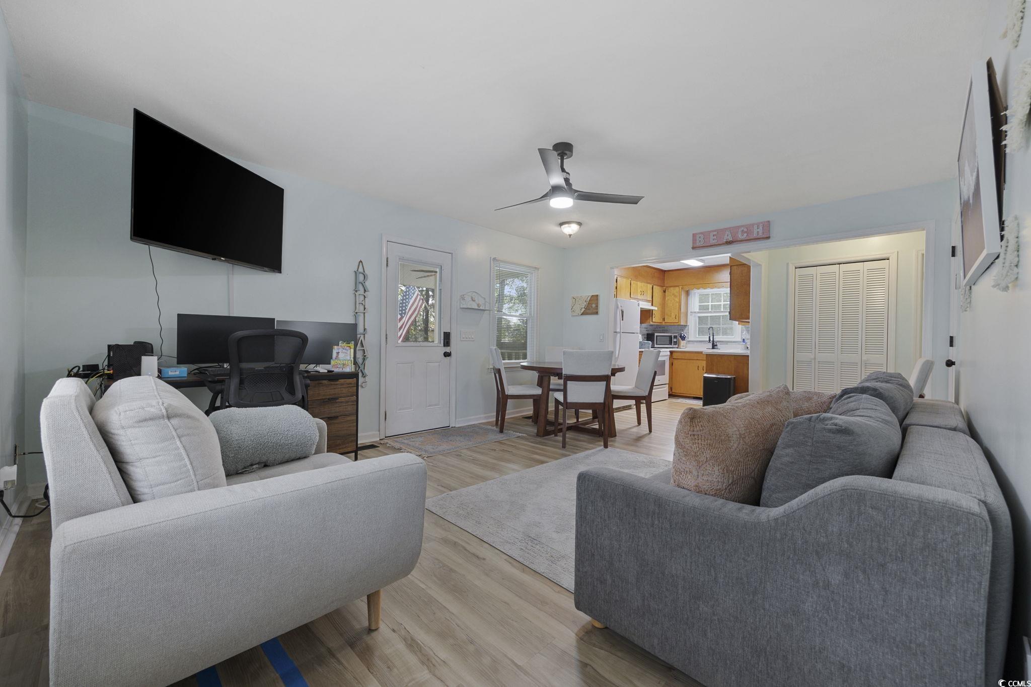 787 Causey Road Murrells Inlet, SC 29576 - Photo 25 of 40 Living room with ceiling fan, light wood-type flooring, and a desk