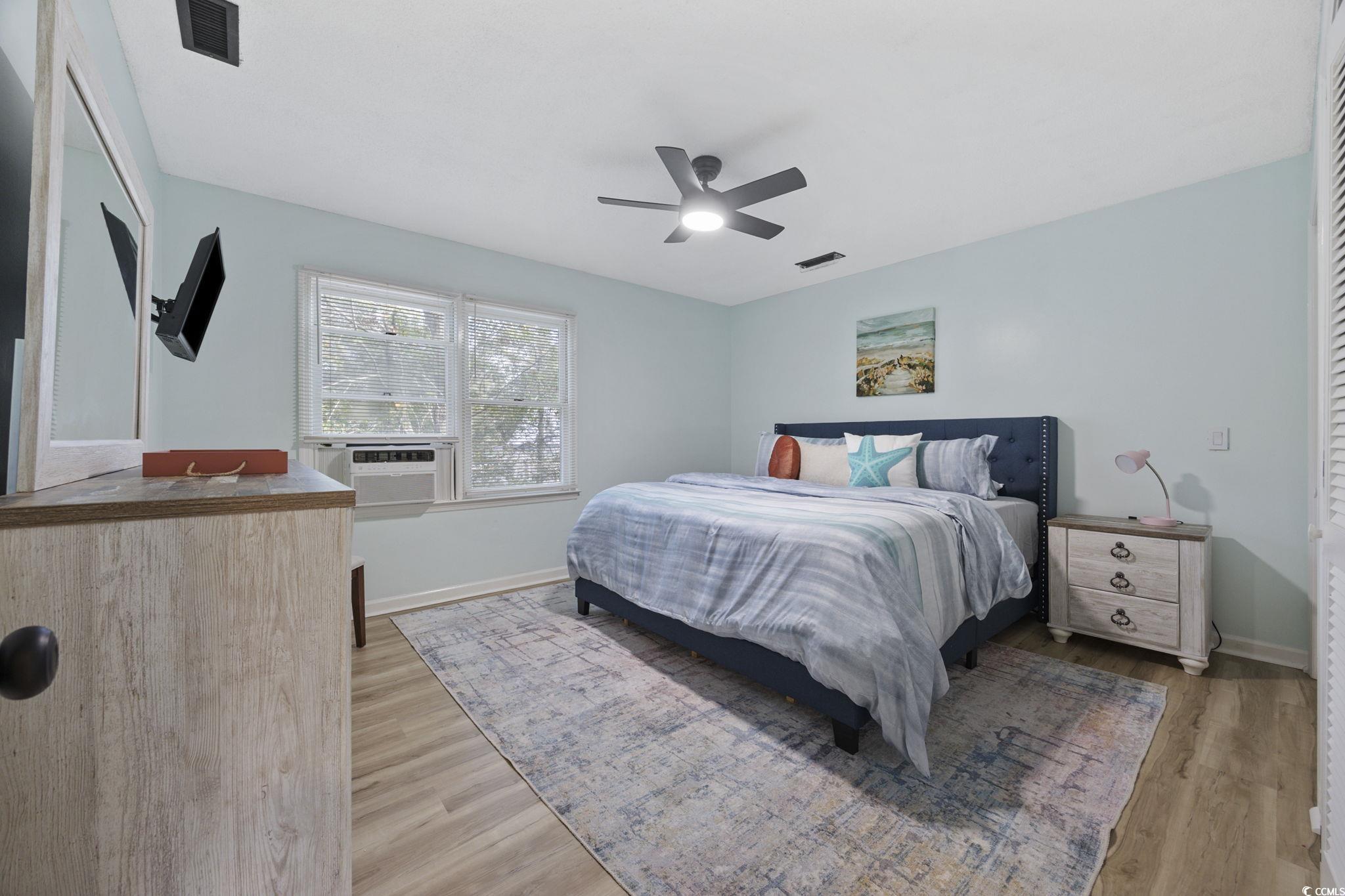 787 Causey Road Murrells Inlet, SC 29576 - Photo 33 of 40 Bedroom featuring ceiling fan, light wood-style flooring, and cooling unit