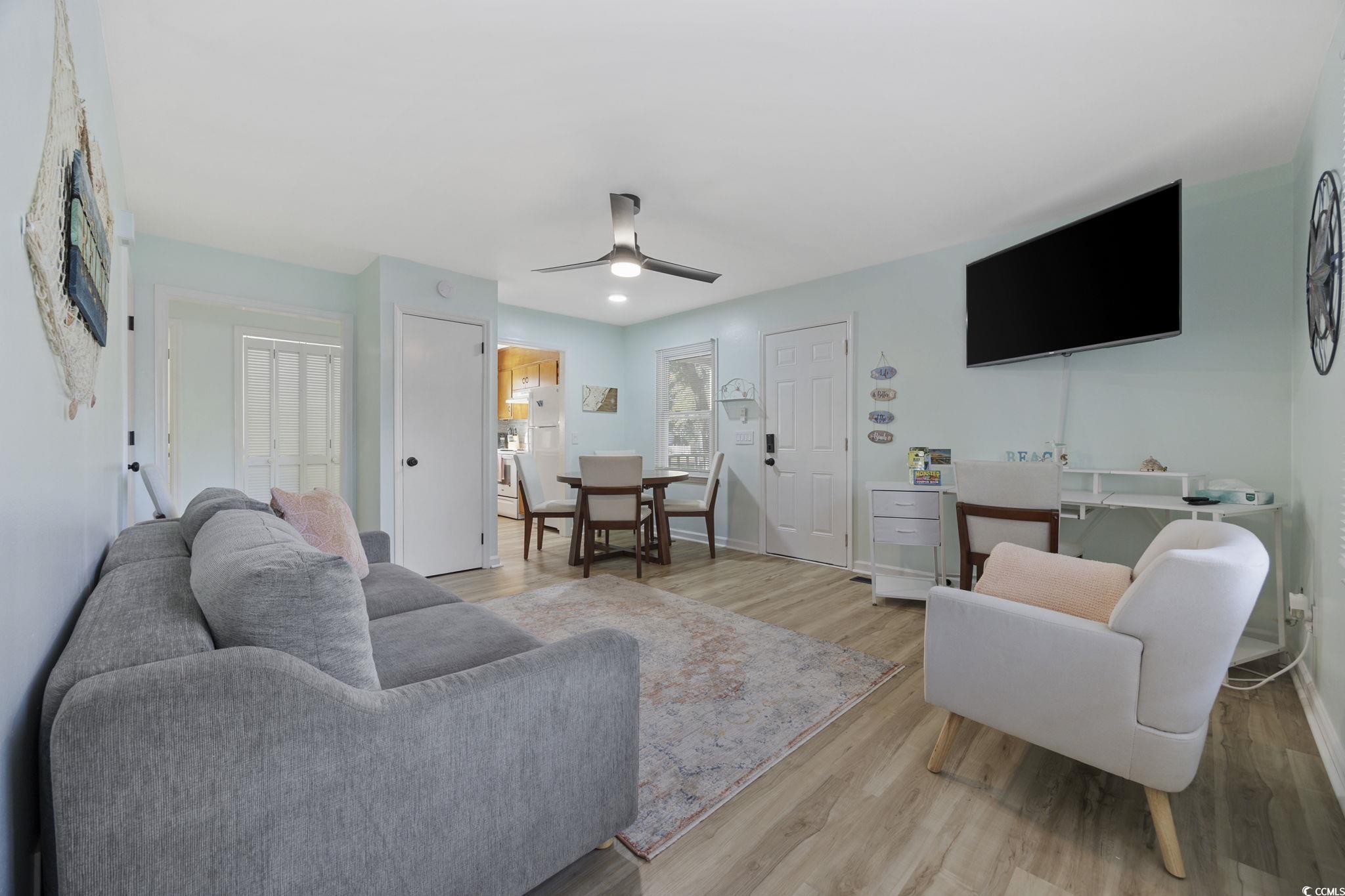 787 Causey Road Murrells Inlet, SC 29576 - Photo 6 of 40 Living area with light wood-style flooring and ceiling fan