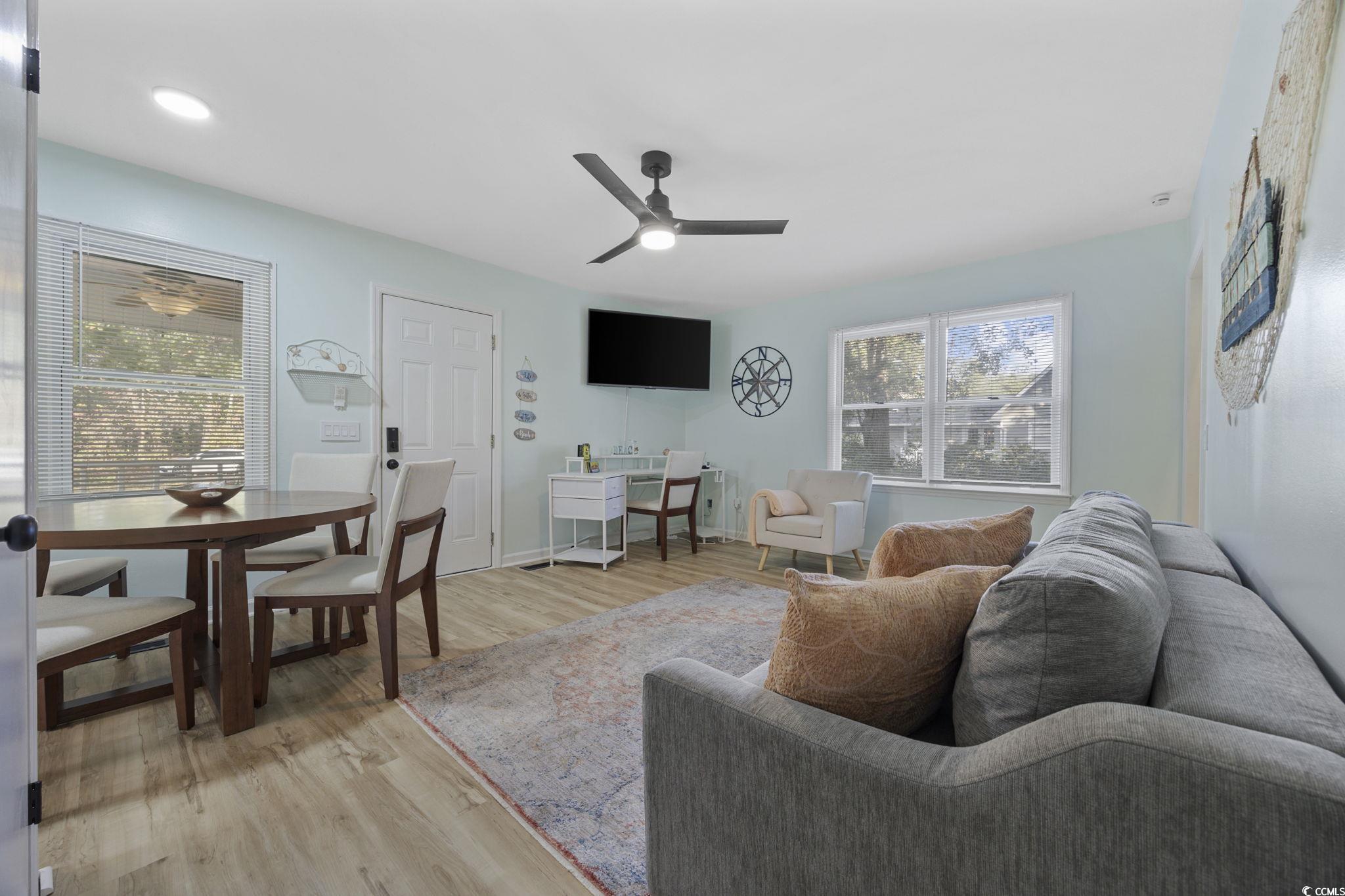 787 Causey Road Murrells Inlet, SC 29576 - Photo 8 of 40 Living room with light wood-type flooring, healthy amount of natural light, and ceiling fan