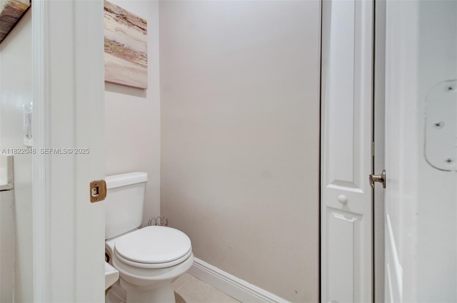 2131 Northeast 37th Road Homestead, FL 33033 - Photo 11 of 34 a white toilet sitting next to a shower