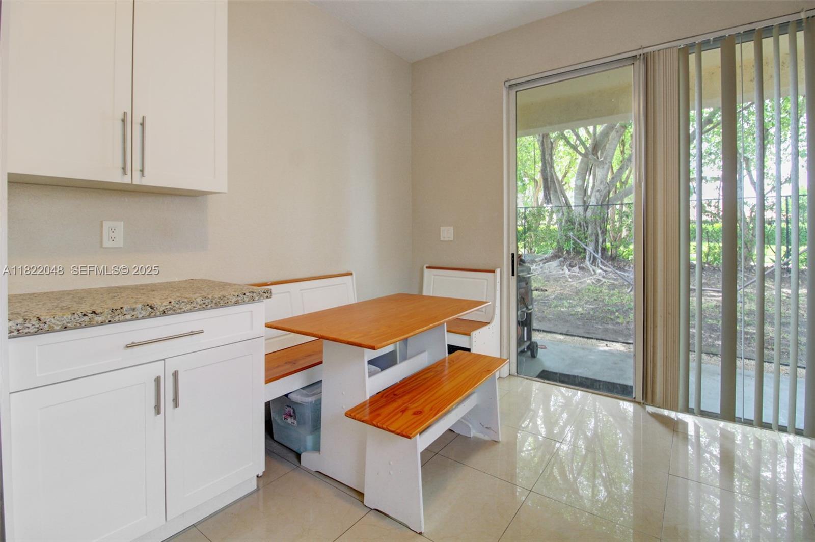 2131 Northeast 37th Road Homestead, FL 33033 - Photo 17 of 34 a bedroom with a bed and glass door