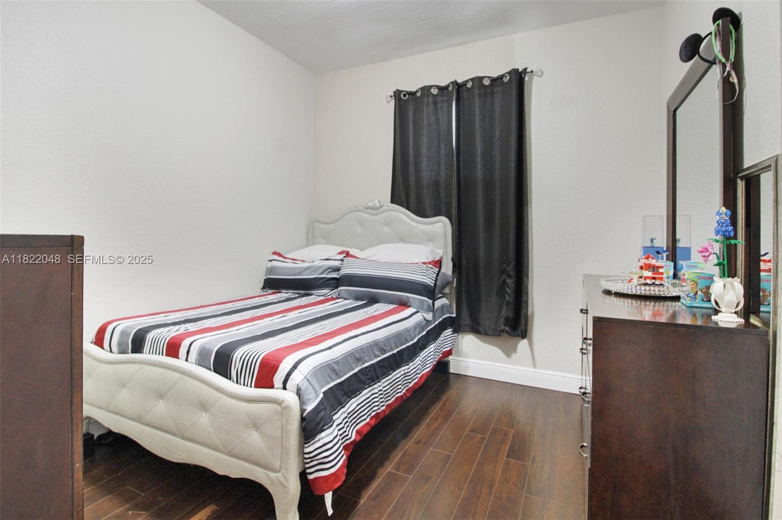 2131 Northeast 37th Road Homestead, FL 33033 - Photo 20 of 34 a bedroom with bed and a dresser