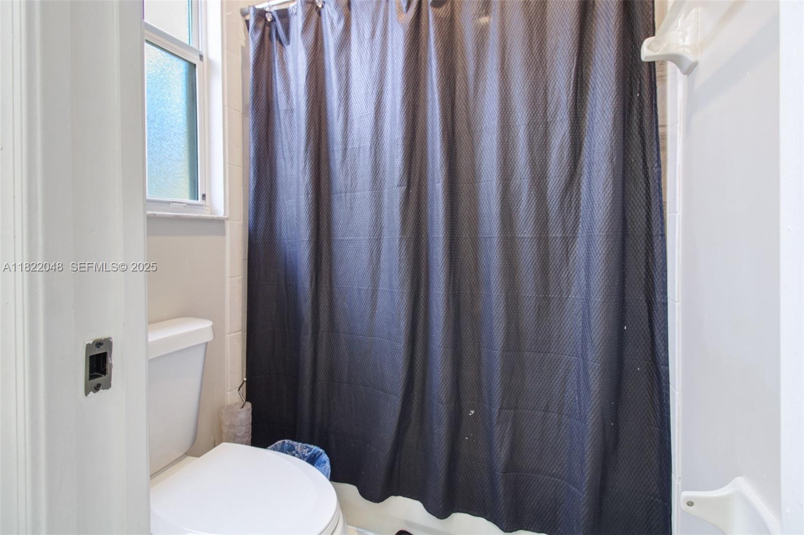 2131 Northeast 37th Road Homestead, FL 33033 - Photo 22 of 34 a white toilet sitting next to a small bathroom