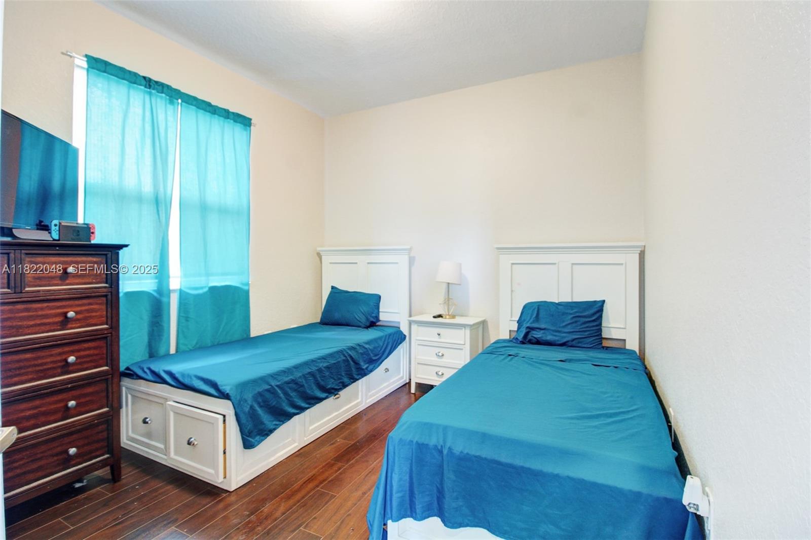 2131 Northeast 37th Road Homestead, FL 33033 - Photo 26 of 34 a bedroom with two beds and painted walls