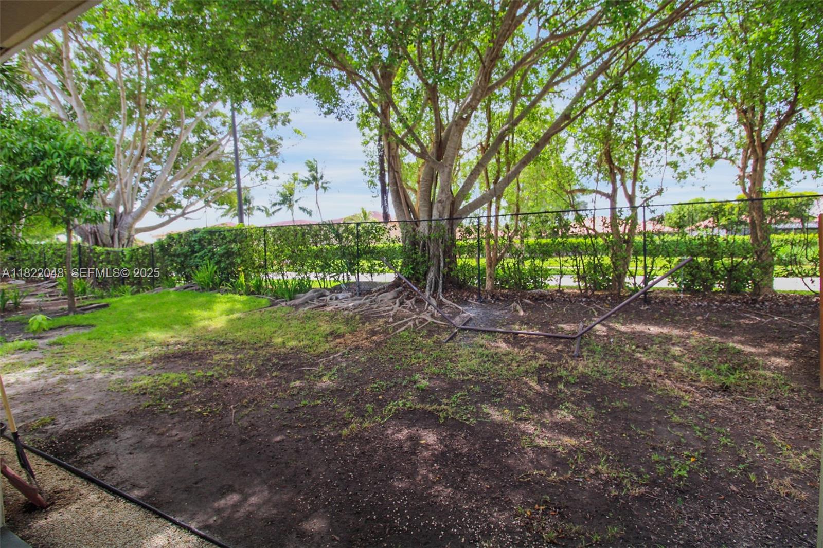 2131 Northeast 37th Road Homestead, FL 33033 - Photo 29 of 34 a view of a yard with plants and trees